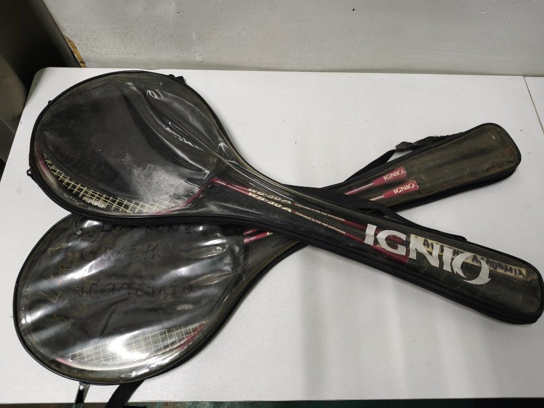 IGNIO WB-30A Badminton Rackets Set with Cases (Category: Racket and Ball Sports) located in San Jose del Monte. Submitted by missalipot (Listing ID 1465746955, Image 1). Description: - Set of 2 IGNIO WB-30A badminton rackets - Includes original protective zippered storage cases with clear vinyl windows - Features stylish pink handle grips with the IGNIO logo - Distinctive red shafts with clear model number markings.