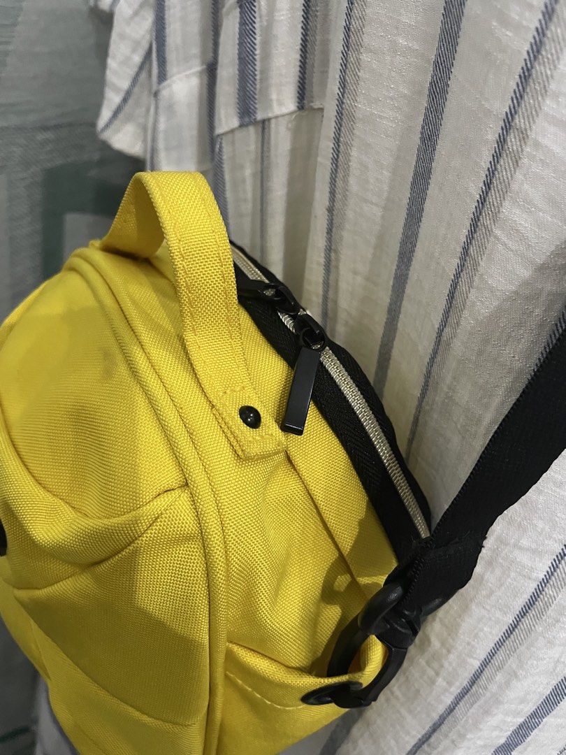 IHOLLEE Mini Backpack Crossbody Bag – Bright Yellow (Category: Belt bags, Clutches and Pouches) located in Cabanatuan. Submitted by moraiahraven (Listing ID 1465753807, Image 3). Description: Cute and practical mini crossbody bag in bright yellow. Features: • Polyester exterior with stylish quilted panel design • Adjustable black shoulder strap (can be worn as crossbody or shoulder bag) • Small yellow top handle for easy grab • Front logo patch: 