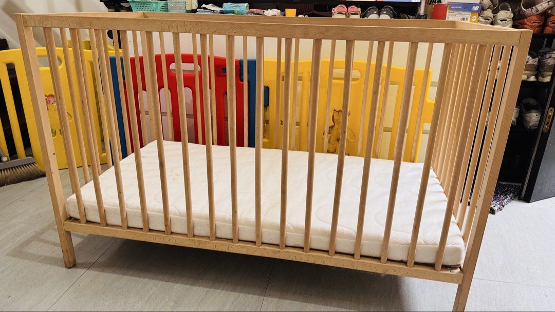 IKEA Beechwood Baby Cot with Mattress (Category: Cots & Cribs) located in Muntinlupa City. Submitted by joanmarcos (Listing ID 1465678406, Image 1). Description: - Solid beech wood baby cot frame with damage on one leg (from dog bite) but still sturdy - Slatted design on all sides for optimal airflow - Sturdy four-leg construction - Standard rectangular size, great for nurseries and toddlers - Includes fitted white mattress (note: has light stain