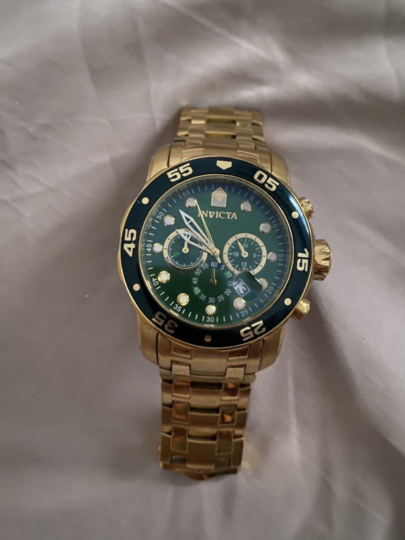 Invicta Pro Diver Model No. 0075 Gold Watch (Category: Men's Watches) located in Plaridel. Submitted by freewind_98bb2d (Listing ID 1465588111, Image 1). Description: - Brand/Model: Invicta Pro Diver Chronograph (Model 0075) - Design: Eye-catching green dial with a dark bezel and gold-tone stainless steel finish - Durability: Flame-fusion crystal and water resistant up to 200m - Features: Functional sub-dials and date window; clasp engraved with 