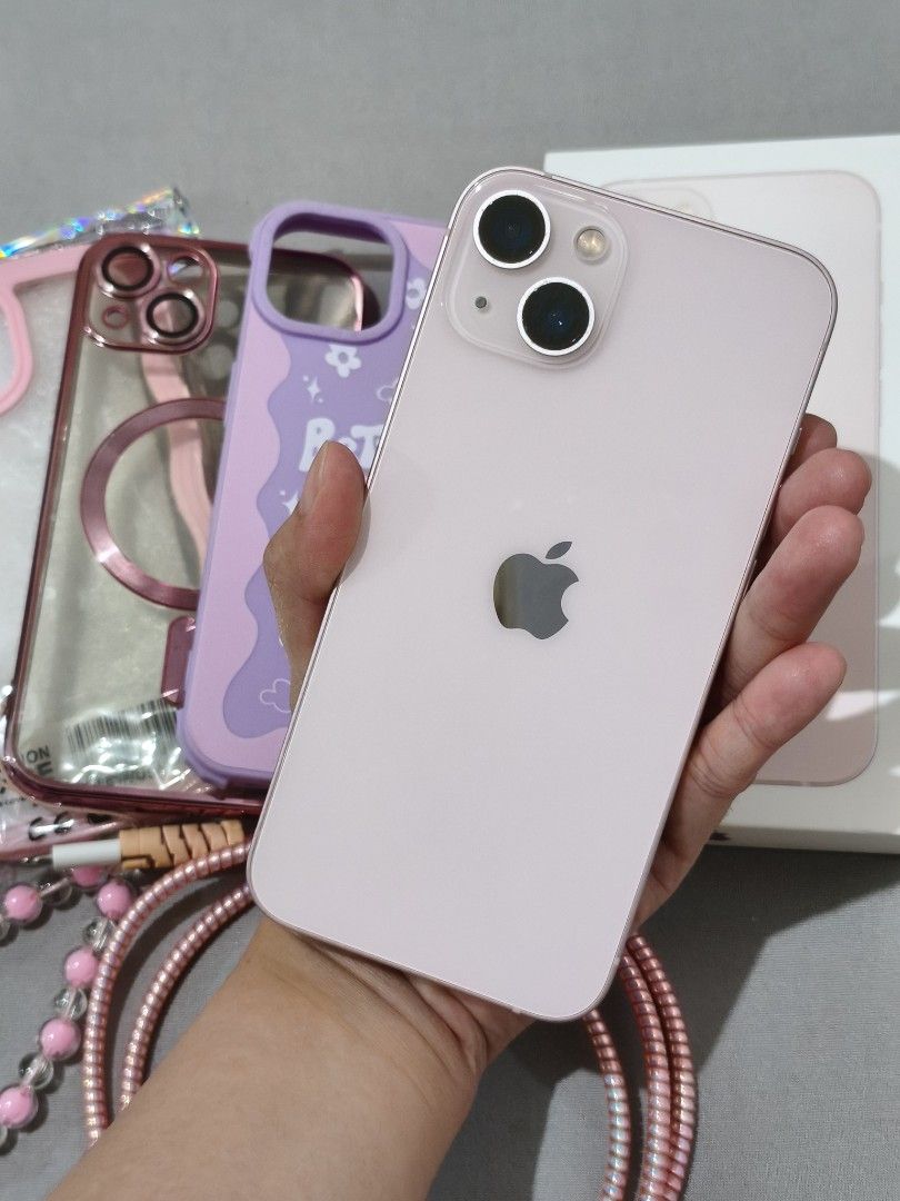 iPhone 13 (Pink) 128 GB (Category: iPhone 13 Series) located in Caloocan City. Submitted by bulgochix (Listing ID 1465582908, Image 3). Description: ✨ Selling my well-loved iPhone 13 in Pastel Pink (128GB)! ✨ Key Specs & Details: -Color: Pink 🌸 -Storage: 128GB -Battery Health: 84% -Good Camera -OS Version: Updated to iOS 26.6.1 -No sim restriction -All parts are original and working fine -Condition: Great physical condition. Screen and body are 