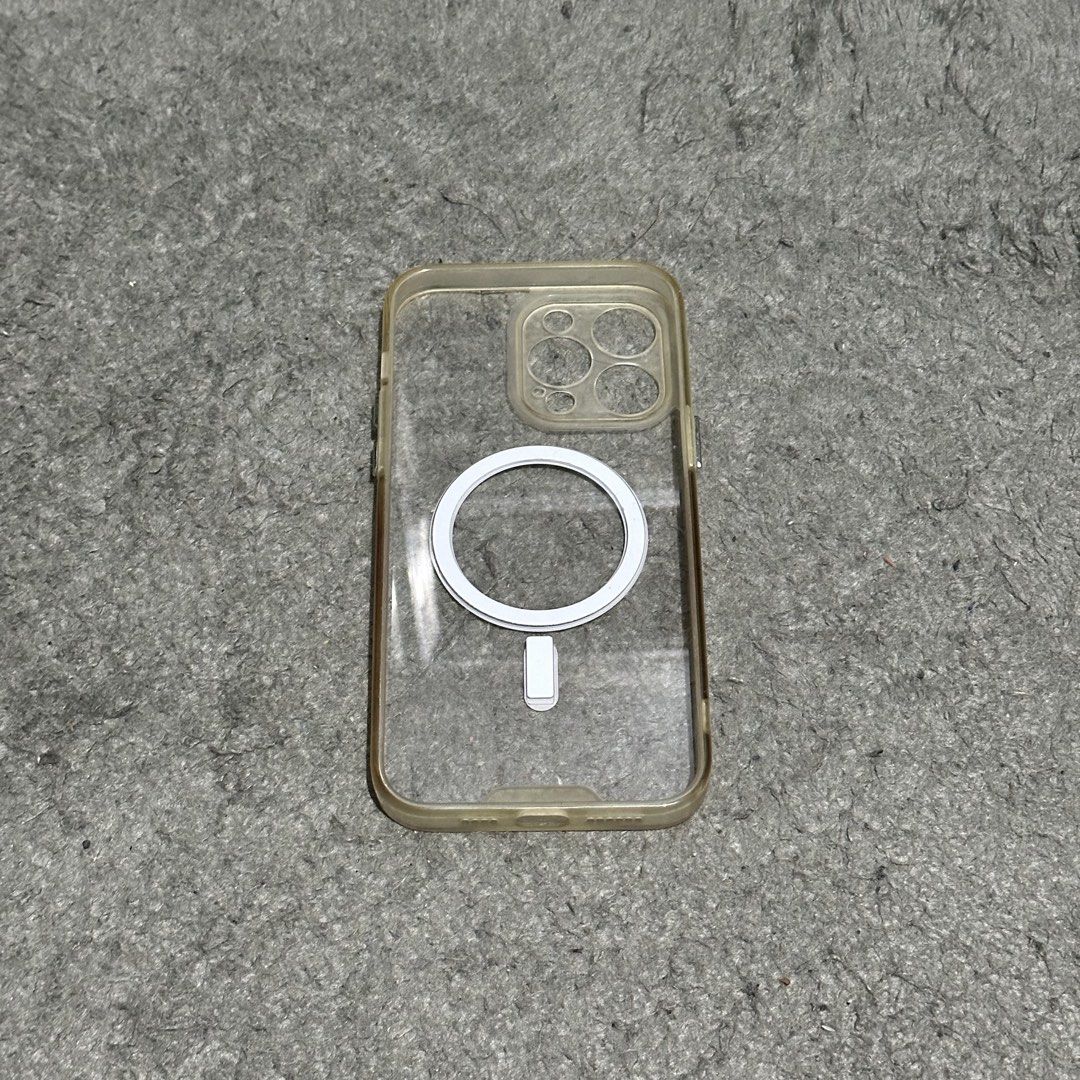 Iphone 14 Pro Max Phone Case (Category: Cases & Sleeves) located in Lipa City. Submitted by jecoparra (Listing ID 1465698745, Image 3). Description: - Compatible with iPhone 14 Pro Max - Clear transparent design with built-in white MagSafe ring - Pre-loved condition with visible yellowing on the bumper edges - Provides reliable daily protection for camera and body - Available for Lalamove shipping only.