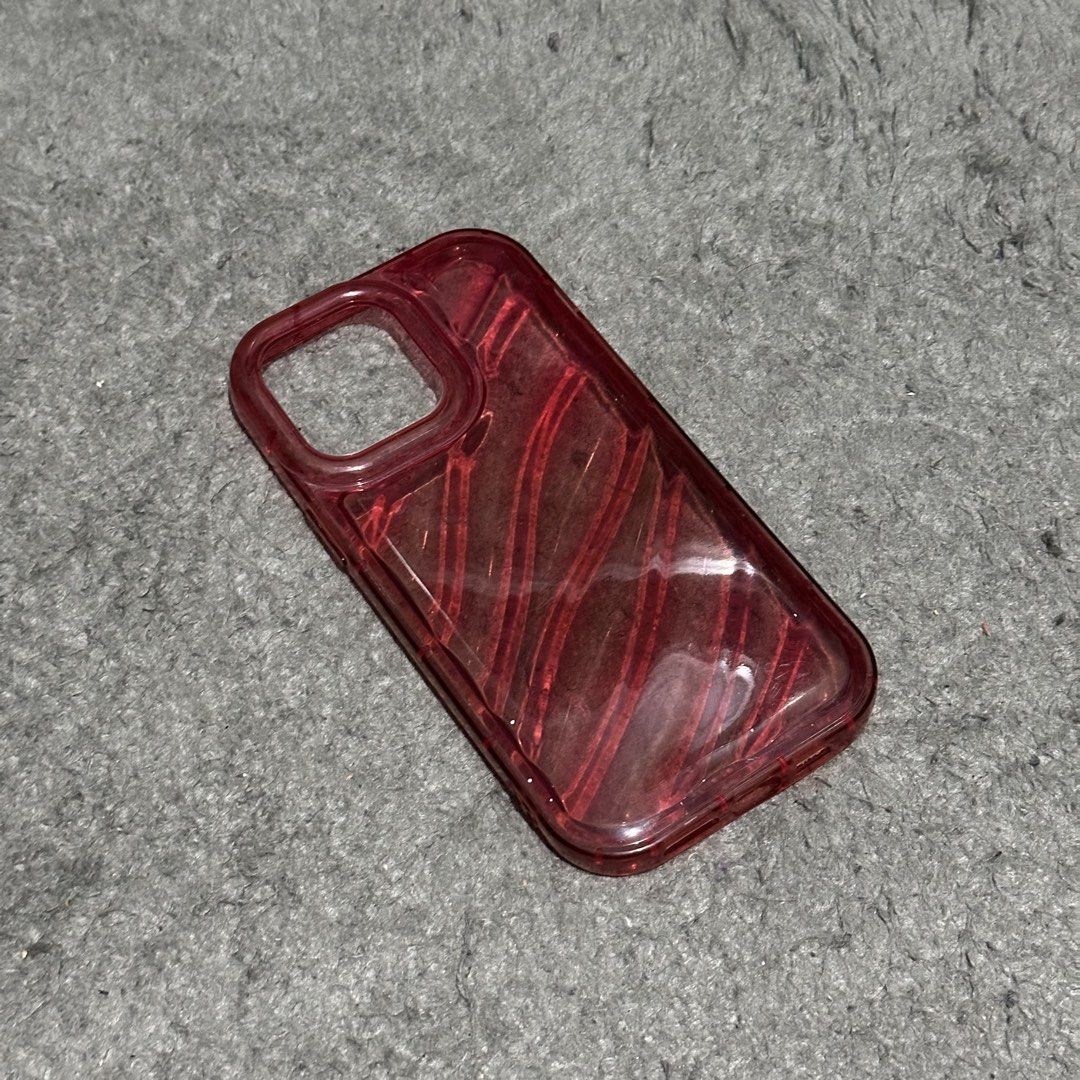 Iphone 14 Pro Max Phone Case (Category: Cases & Sleeves) located in Lipa City. Submitted by jecoparra (Listing ID 1465700047, Image 2). Description: - Compatible Model: iPhone 14 Pro Max - Color: Vibrant Red - Design: Translucent with diagonal striped texture - Condition: Excellent, well-maintained - Protection: Durable shell to keep your phone safe from scratches.
