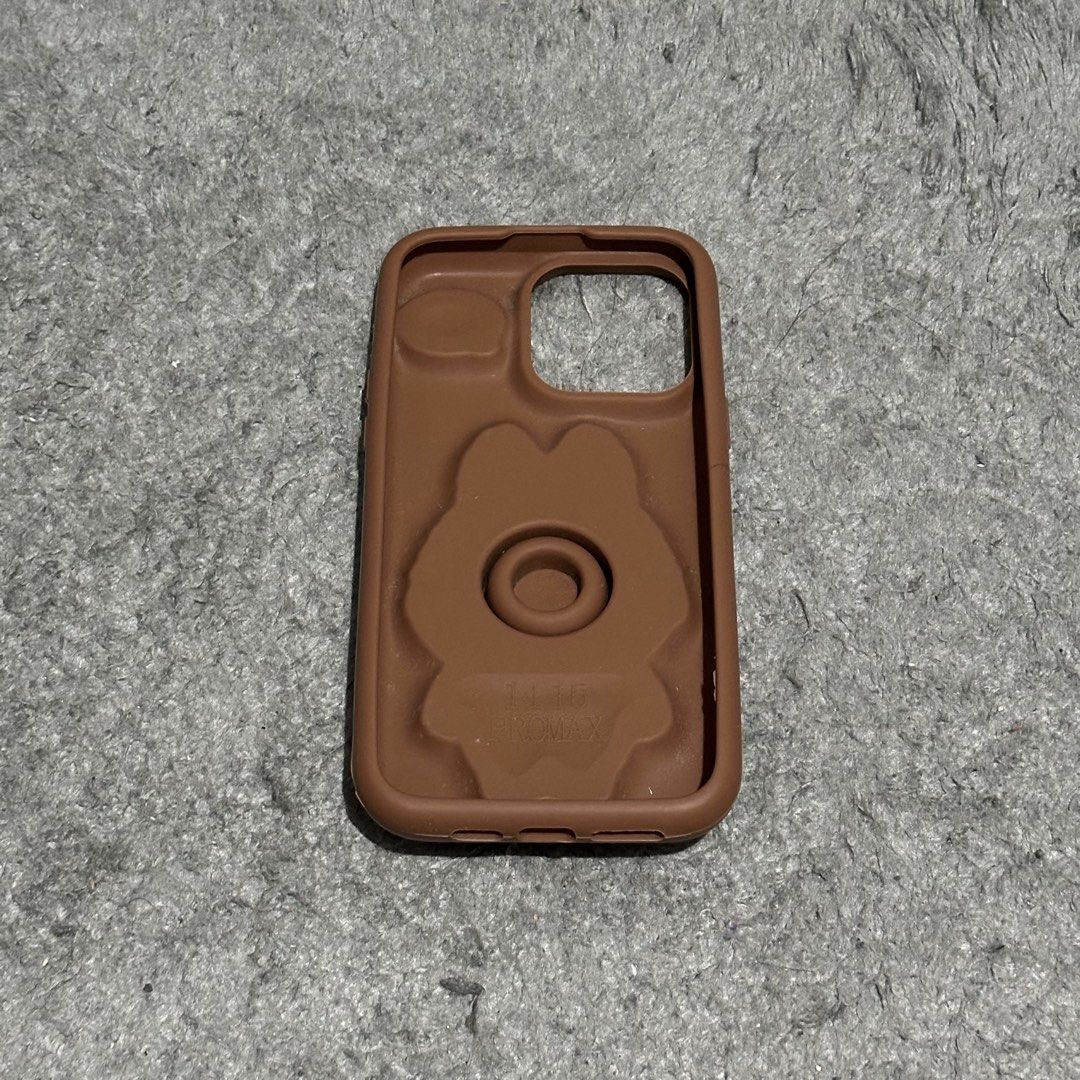 Iphone 14 Pro Max Phone Case (Category: Cases & Sleeves) located in Lipa City. Submitted by jecoparra (Listing ID 1465702315, Image 3). Description: - Compatible Model: iPhone 14 Pro Max - Color: Brown - Material: High-quality flexible silicone - Design: Cute 3D embossed Labubu monster character with text detail - Condition: Excellent / gently used - Features: Provides daily protection, anti-slip texture, and unique playful aesthetic.