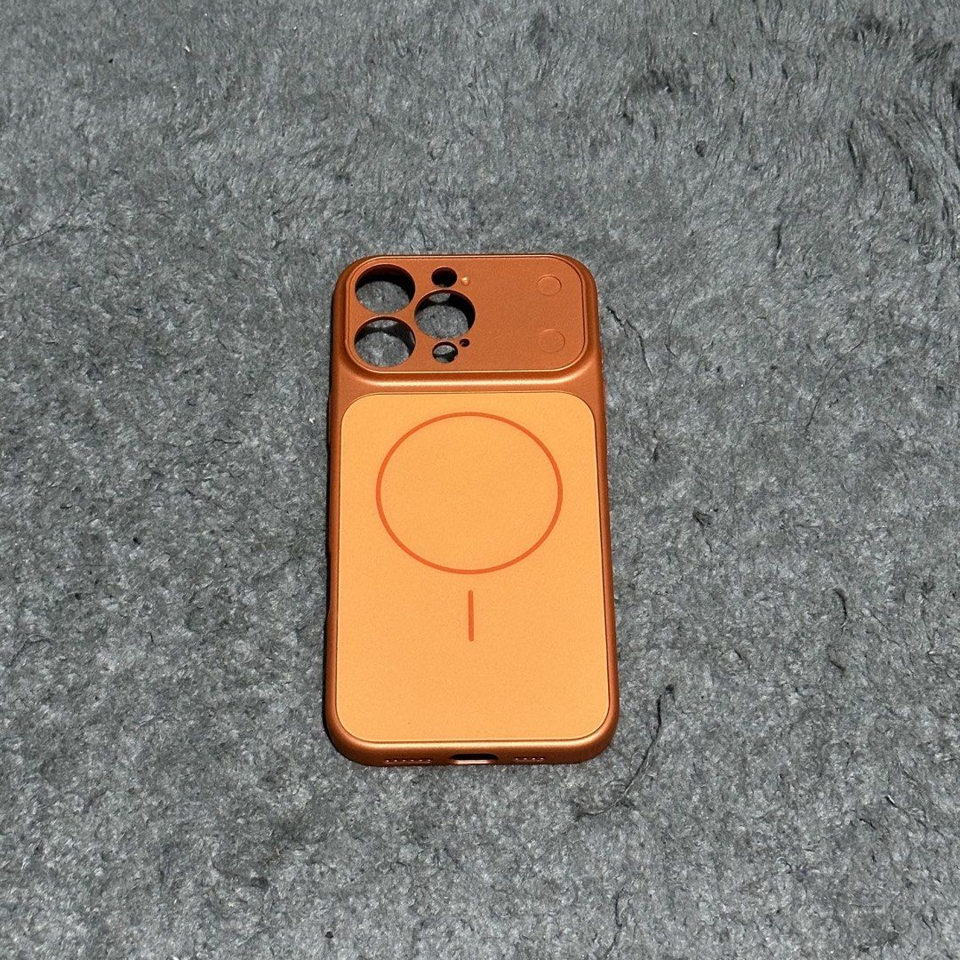 Iphone 16 Pro Max Phone Case (Category: Cases & Sleeves) located in Lipa City. Submitted by jecoparra (Listing ID 1465703749, Image 1). Description: - Compatible Model: iPhone 16 Pro Max - Color: Metallic Copper / Orange - Features built-in MagSafe magnetic charging ring - Premium metallic finish with full camera module protection - Precise cutouts for ports, speakers, and buttons - Sleek, lightweight, and durable design.