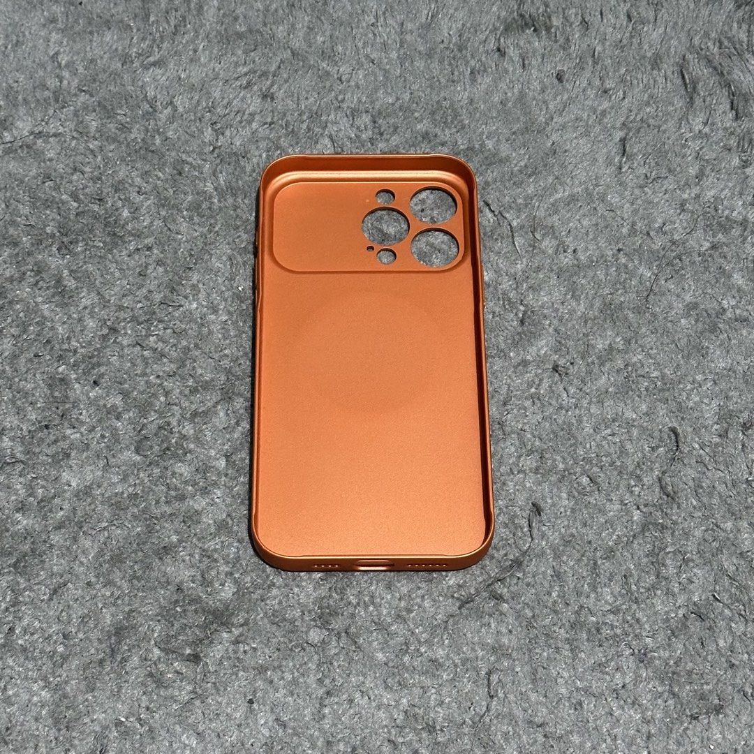 Iphone 16 Pro Max Phone Case (Category: Cases & Sleeves) located in Lipa City. Submitted by jecoparra (Listing ID 1465703749, Image 3). Description: - Compatible Model: iPhone 16 Pro Max - Color: Metallic Copper / Orange - Features built-in MagSafe magnetic charging ring - Premium metallic finish with full camera module protection - Precise cutouts for ports, speakers, and buttons - Sleek, lightweight, and durable design.