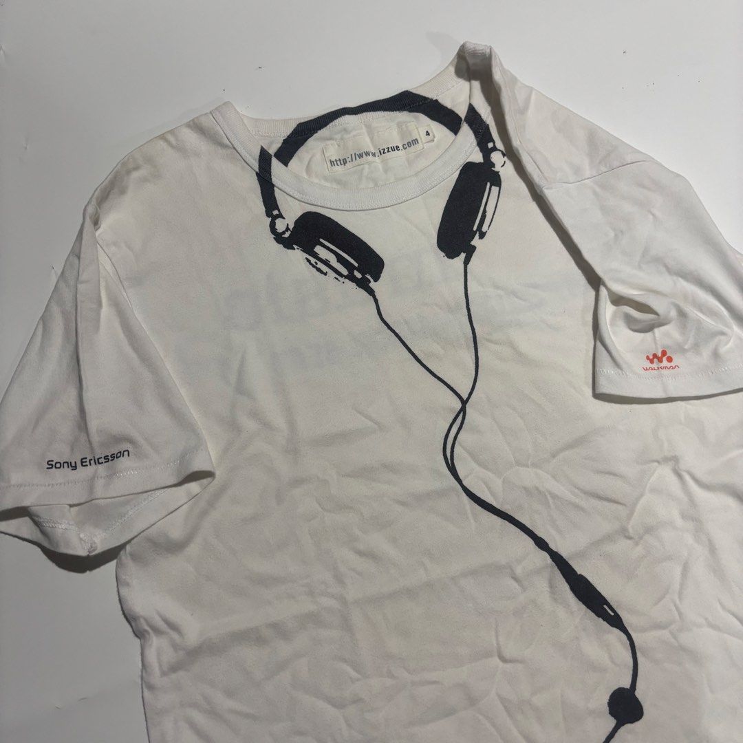Izzue x Sony Ericsson Walkman Graphic Tee Size 4 (Category: Tshirts & Polo Shirts ) located in Cebu City. Submitted by kidfrom6000 (Listing ID 1465749877, Image 3). Description: - Brand: Izzue x Sony Ericsson Walkman collaboration - Color: White with front headphone and cord graphic - Details: Sony Ericsson branding on right sleeve, Walkman logo on left sleeve - Size: 4 - Material & Care: Cotton, hand wash only - Style: Casual music merch / stree