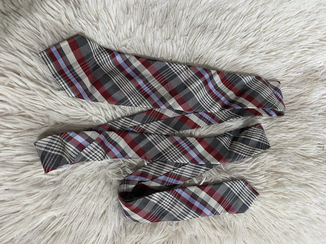 Jill Stuart New York Plaid Necktie (Category: Ties) located in Bulacan. Submitted by rich2545 (Listing ID 1465581492, Image 1). Description: - Brand: Jill Stuart New York - Design: Classic plaid pattern with grey, burgundy, white, and light blue stripes - Condition: Brand new with tag attached, very clean - Features: Secure fabric keeper loop and stitched brand label on the back - Versatility: Ideal for work, formal events, and smart casual outfi
