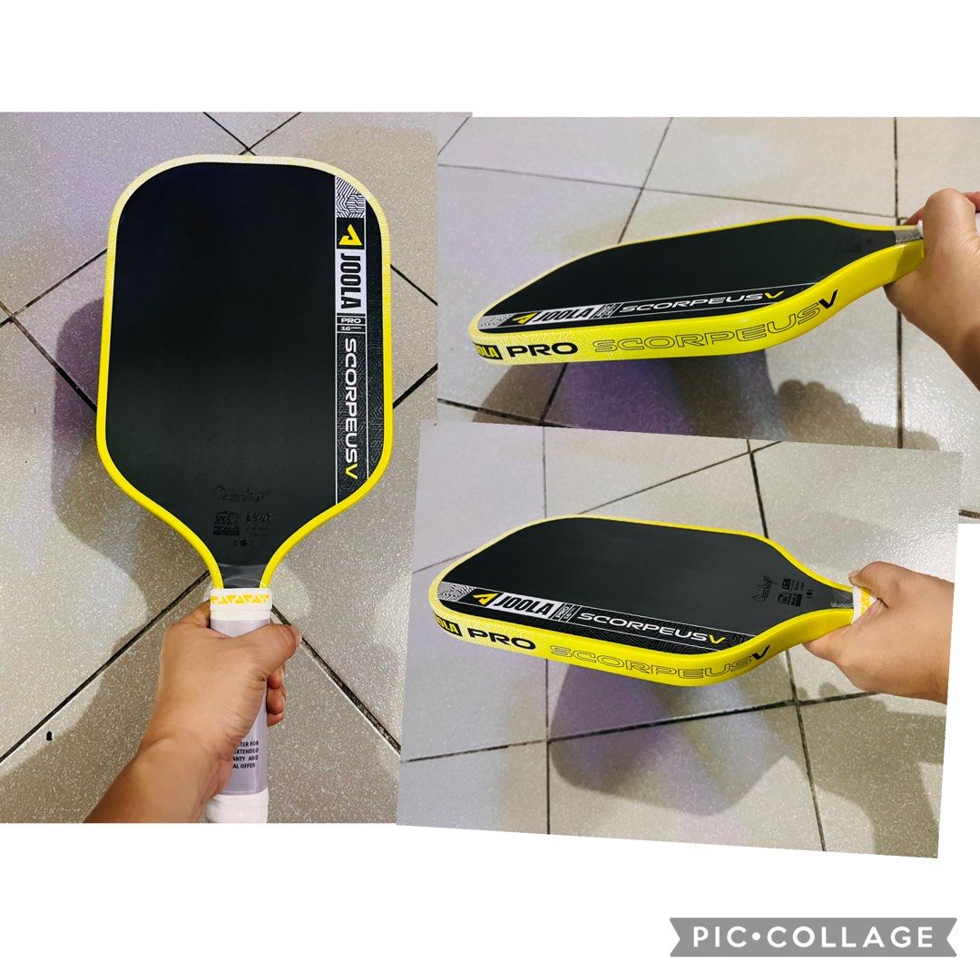 JOOLA Pro Perseus 16mm Pickleball Paddle (Category: Racket and Ball Sports) located in Quezon City. Submitted by pickleballpaddle (Listing ID 1465624500, Image 2). Description: - Brand: JOOLA Pro Perseus 16mm - Color: Black and light blue - Shape: Standard elongated shape with textured edge guard - Condition: Brand new, never used on court, pristine condition - Extras: Handle grip still wrapped in original plastic with 'Remove Foil Tap Here' stic