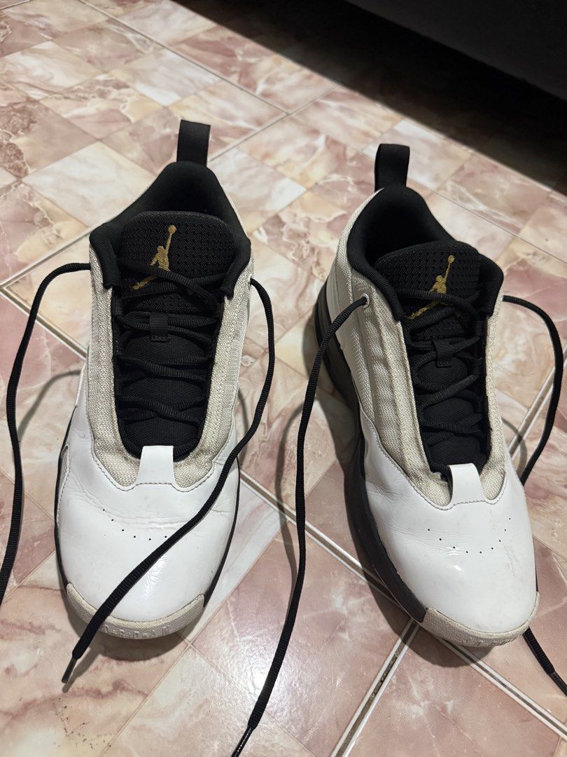 Jordan Max Aura 6 Flight (Category: Sneakers) located in Manila. Submitted by vinczentiments (Listing ID 1465751351, Image 3). Description: - Model: Jordan Flight sneakers - Colorway: Classic white and black with a gold Jumpman logo on the tongue - Materials: Durable mesh and leather panels with black laces and dark soles - Condition: Not wornout “walang pudpod” - Versatility: Perfect for basketball games or daily casual street outfits No Box.
