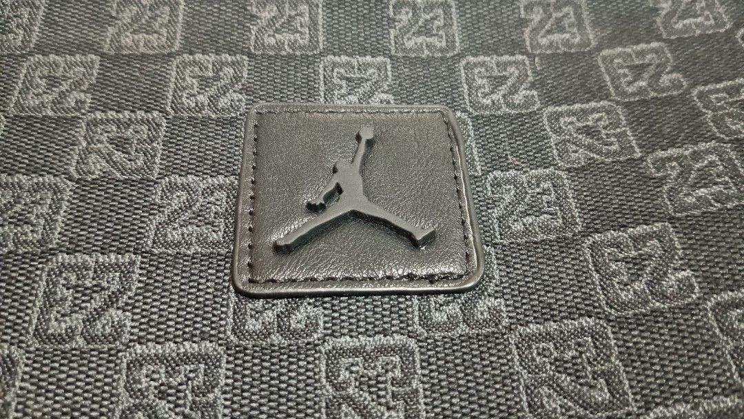Jordan Monogram Clutch Pouch Large (Category: Belt bags, Clutches and Pouches) located in Quezon City. Submitted by baxt3r (Listing ID 1465702722, Image 3). Description: - Authentic Jordan monogram pouch in sleek black and grey - Features all-over '23' pattern with stitched Jumpman logo patch - Convenient zip top closure and attached wrist strap - Clean interior lining with 100% polyester material - Great size for organizing and carrying daily es