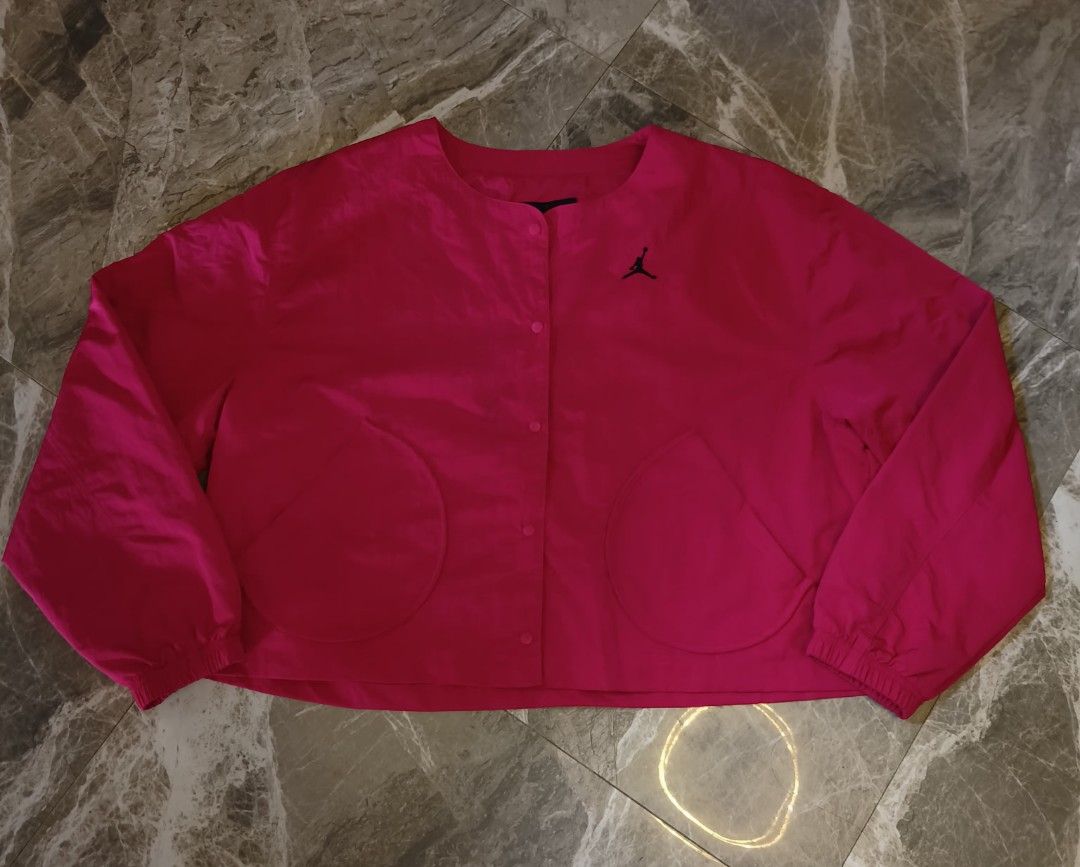 Jordan Pink Oversized Fit Jacket (Category: Coats, Jackets and Outerwear) located in Alaminos. Submitted by christianberbo (Listing ID 1465617614, Image 1). Description: - Brand: Jordan - Color: Bright Pink with Black Jumpman logo - Fit: Oversized style - Material: Lightweight nylon and polyester - Closure: Snap button front - Pockets: Large round pockets on both sides - Condition: Brand new / excellent - Mode of payment: GCash, - Shipping: Same 