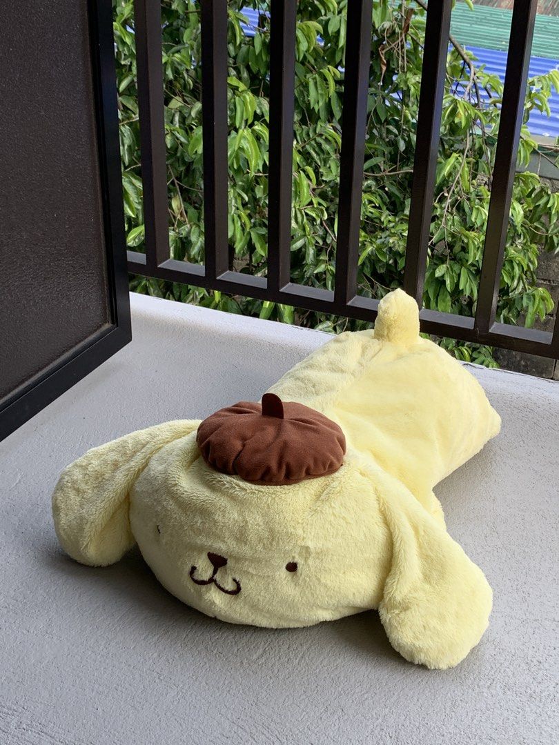 Jumbo Sanrio Pompompurin Lying Plush (Category: Plushies & Soft Toys) located in Angeles City. Submitted by pablokids (Listing ID 1465642055, Image 1). Description: - Authentic Pompompurin plushie in an adorable lying down pose - Super soft, squishy, and huggable material - Detailed with his iconic brown beret, brown paws, and tiny tail with an embroidered star - Perfect for cuddles or as a cute room decor piece -only issue is parang hindi na mas