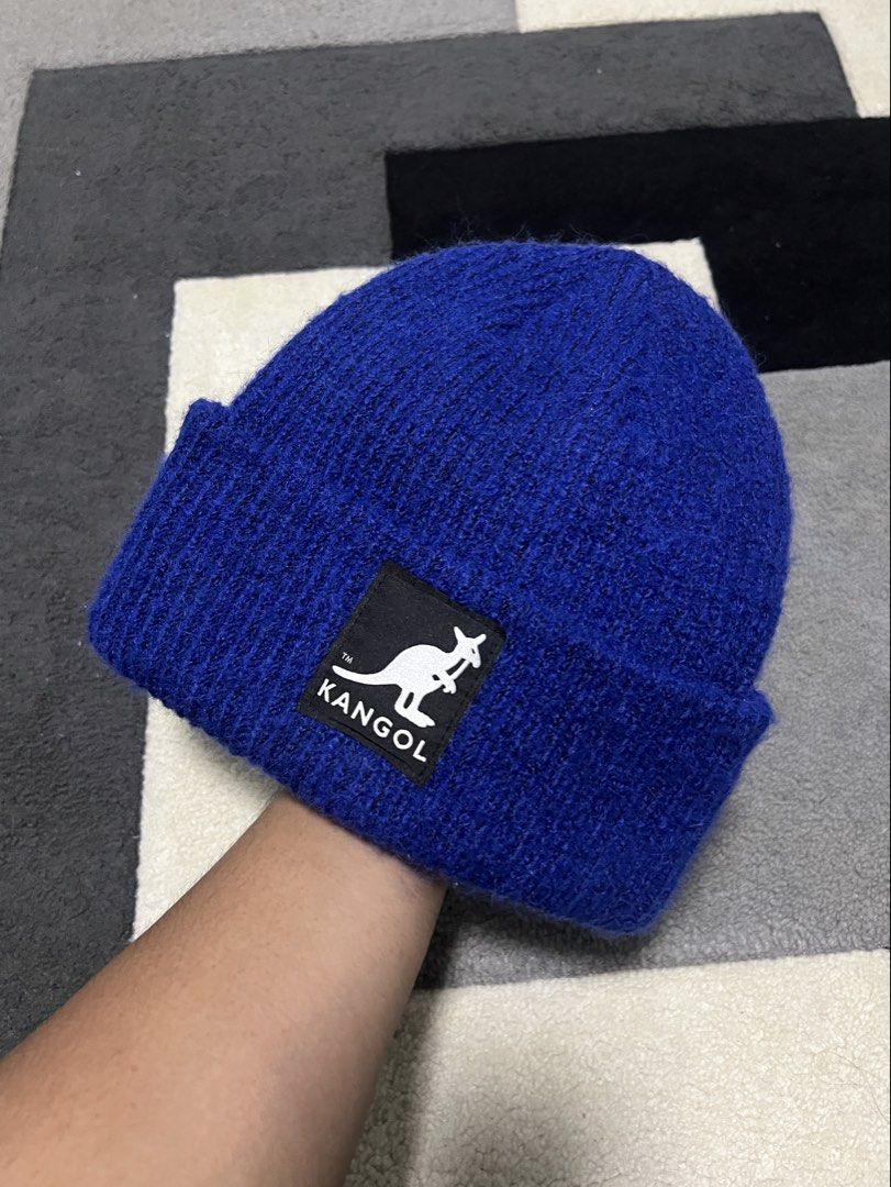 Kang x H&M Blue Beanie (Category: Hats & Beanies) located in Calasiao. Submitted by pb.supply_v2 (Listing ID 1465752785, Image 1). Description: - Brand: Kangol x H&M - Color: Bright blue - Design: Classic folded cuff with embroidered kangaroo logo patch - Material: Soft and fuzzy yarn for extra warmth - Size: One size fits most adults - Style: Perfect for streetwear and casual everyday wear.