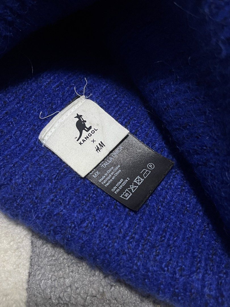 Kang x H&M Blue Beanie (Category: Hats & Beanies) located in Calasiao. Submitted by pb.supply_v2 (Listing ID 1465752785, Image 3). Description: - Brand: Kangol x H&M - Color: Bright blue - Design: Classic folded cuff with embroidered kangaroo logo patch - Material: Soft and fuzzy yarn for extra warmth - Size: One size fits most adults - Style: Perfect for streetwear and casual everyday wear.