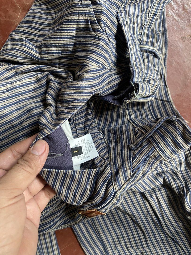 Kapital Hickory Stripe Work Pants (Category: Trousers) located in Laguindingan. Submitted by purto_nato42 (Listing ID 1465730096, Image 3). Description: - Brand: Kapital (Made in Japan) - Style: Hickory stripe work trousers with straight leg fit - Details: Blue and white striped heavy-duty fabric with unique brown leather reinforcement patches at pockets and crotch - Closure: Classic button fly - Size: Tagged Size 1 - Condition: Excellent, heavy-
