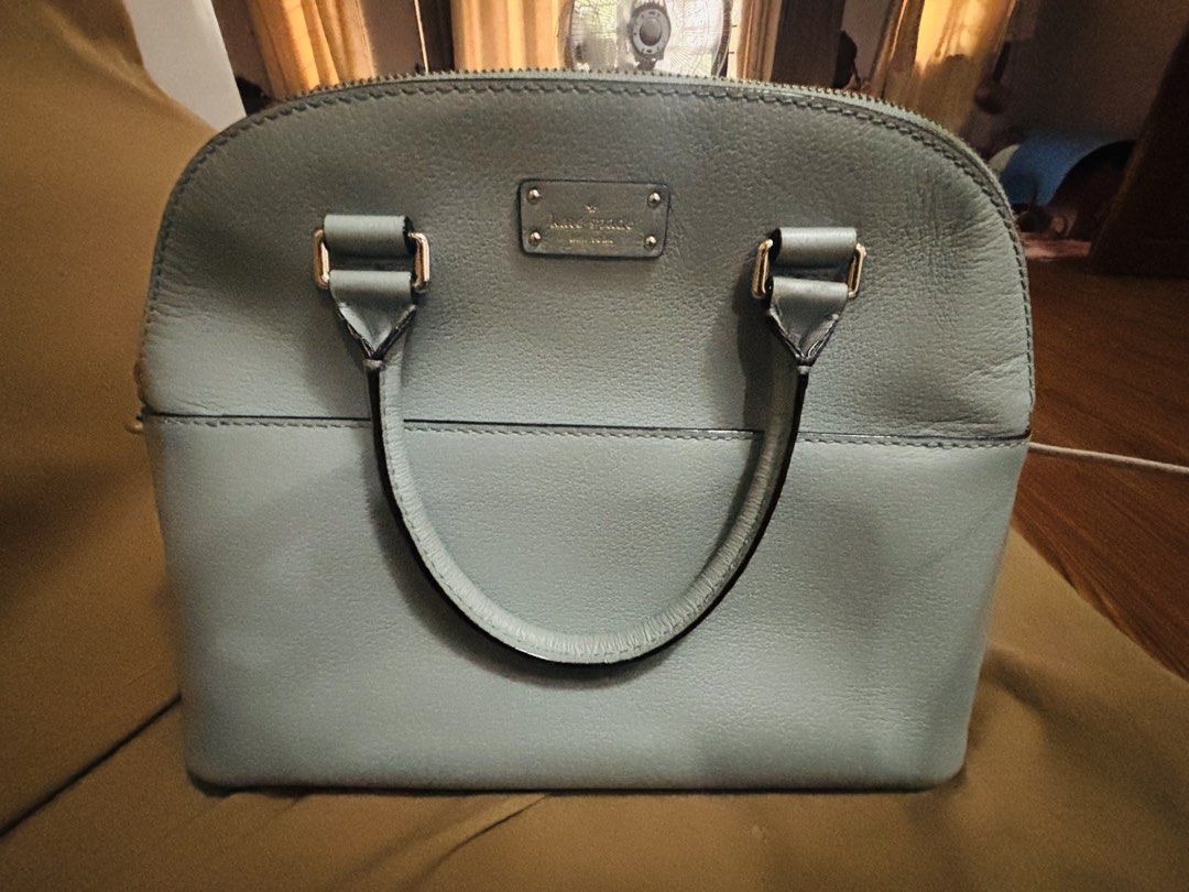 Kate Spade Light Blue Dome Satchel Handbag (Category: Tote Bags) located in Marikina City. Submitted by tracykrystlem (Listing ID 1465607173, Image 2). Description: - Brand: Kate Spade - Style: Dome Satchel - Material: Premium pebbled leather in a charming light blue shade - Hardware: Silver-toned accents - Closure: Top zip closure - Handles: Twin grab handles for easy carrying - Pockets: Convenient exterior slip pocket - Interior: Clean, spaciou