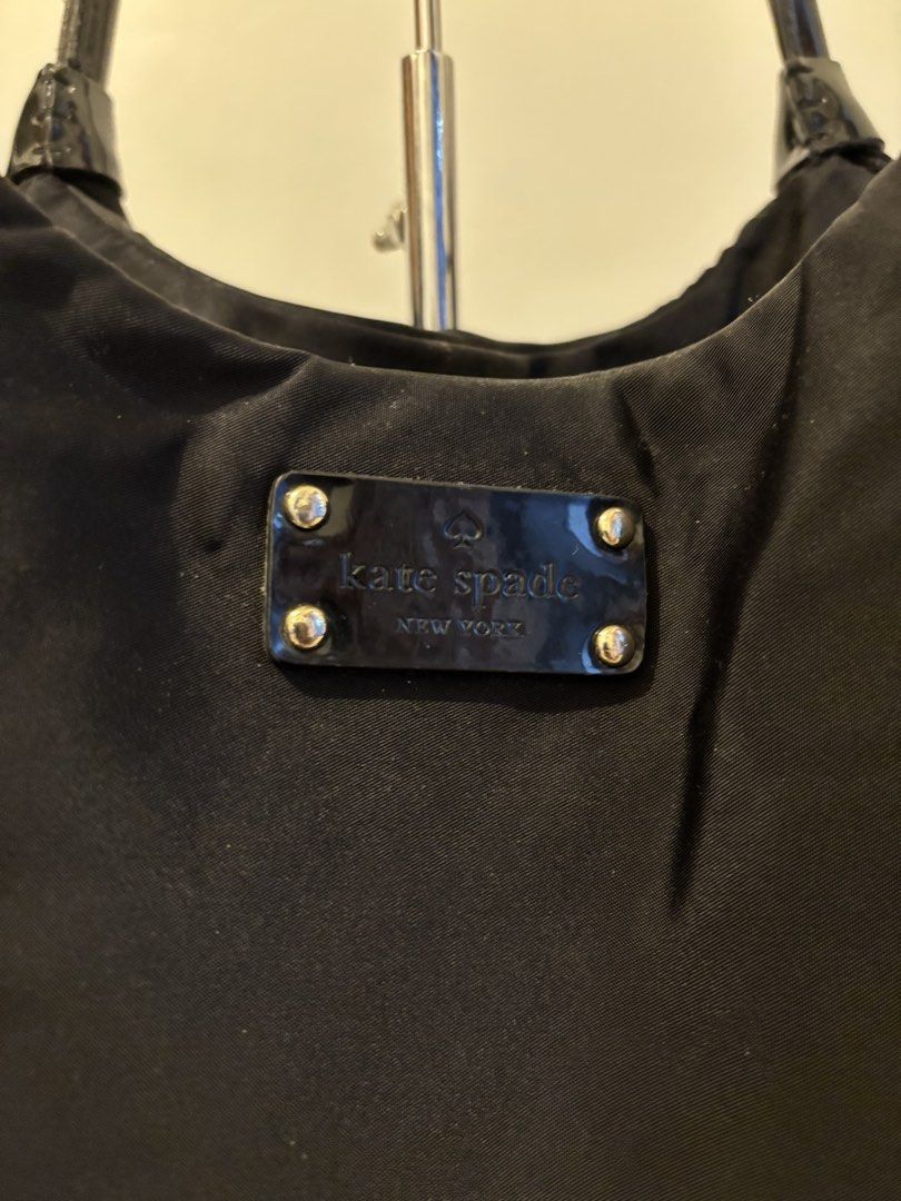 Kate Spade Nylon Hobo Bag (Category: Luxury Bags & Wallets) located in Tagaytay City. Submitted by zeyla (Listing ID 1453026313, Image 3). Description: Actual photos already posted Kate Spade Hobo Black Nylon Zip Closure at Top Dual Interior and Exterior Side Pockets Sides, Bottom and Handles are Patent trim.
