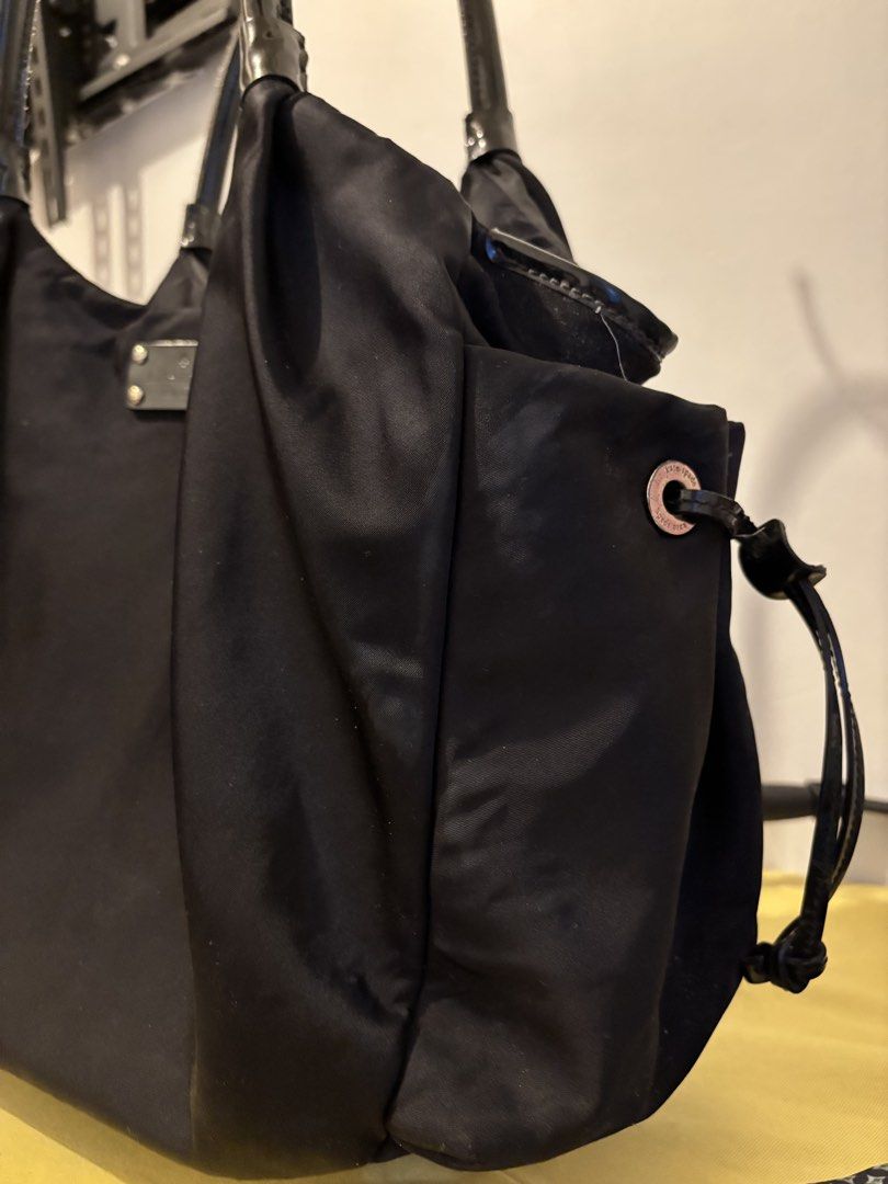 Kate Spade Nylon Hobo Bag (Category: Luxury Bags & Wallets) located in Tagaytay City. Submitted by zeyla (Listing ID 1453026313, Image 2). Description: Actual photos already posted Kate Spade Hobo Black Nylon Zip Closure at Top Dual Interior and Exterior Side Pockets Sides, Bottom and Handles are Patent trim.