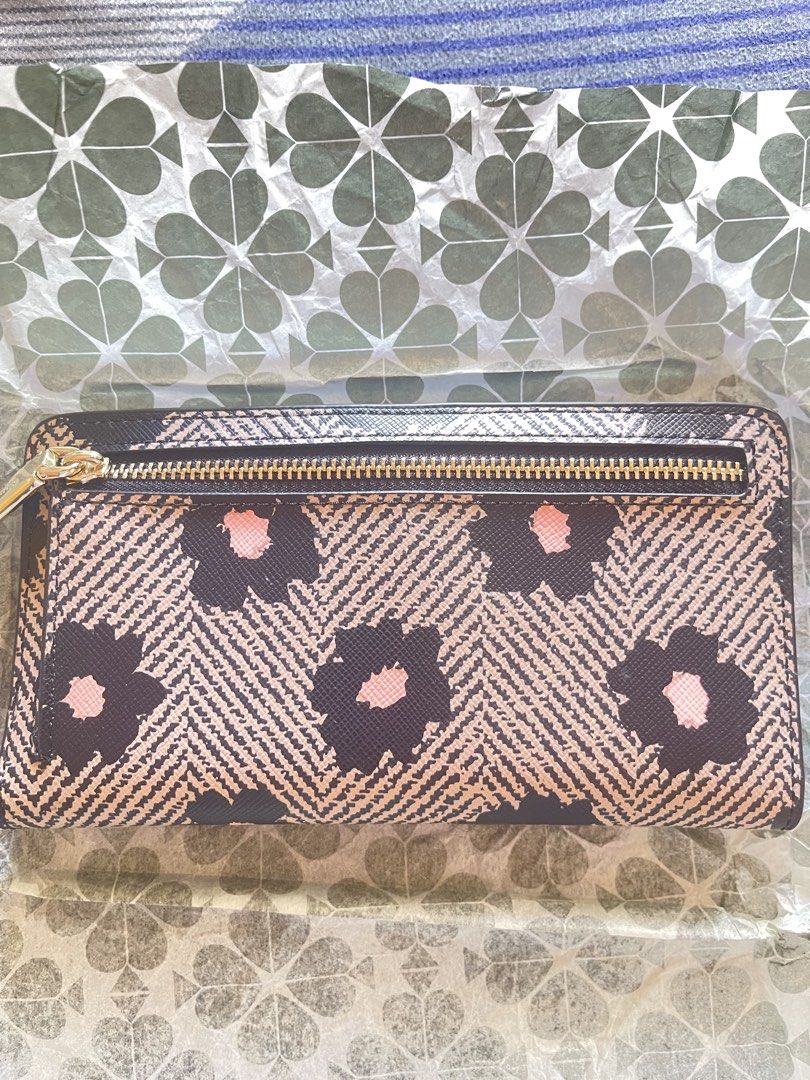 Kate Spade Staci Floral Herringbone Continental Wallet (Category: Wallets & Card holders) located in Manila. Submitted by schylerlucas (Listing ID 1465593199, Image 3). Description: Available on hand, ready to ship Brand new - Authentic Kate Spade Staci Wallet - Black multi floral print on herringbone background - Secure zip-around closure with gold-tone hardware - Exterior back zip pocket for coins or receipts - Interior lined with black leather