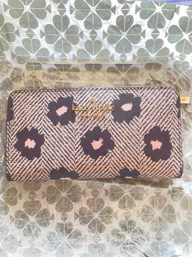 Kate Spade Staci Floral Herringbone Continental Wallet (Category: Wallets & Card holders) located in Manila. Submitted by schylerlucas (Listing ID 1465593199, Image 1). Description: Available on hand, ready to ship Brand new - Authentic Kate Spade Staci Wallet - Black multi floral print on herringbone background - Secure zip-around closure with gold-tone hardware - Exterior back zip pocket for coins or receipts - Interior lined with black leather