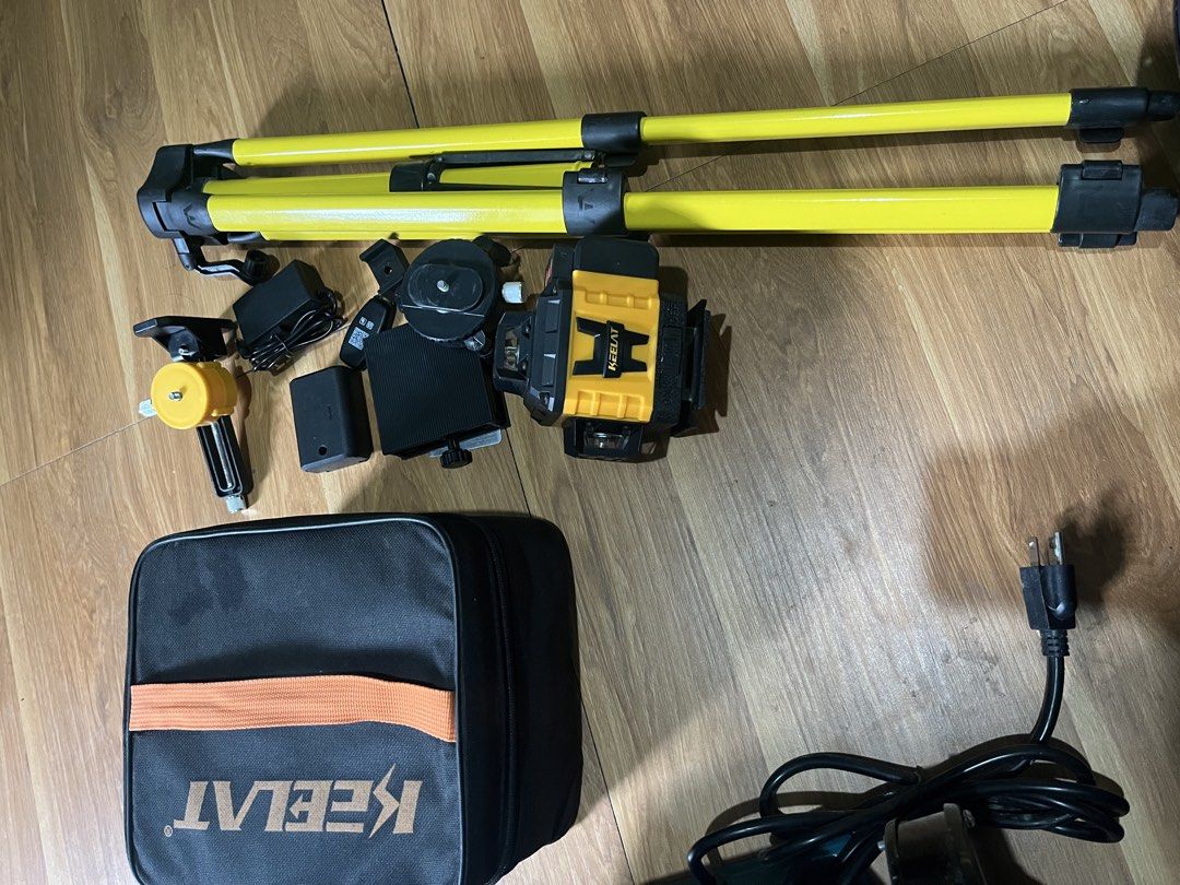 Keelat Green Beam Laser Level with Tripod Set (Category: Construction Tools & Equipment) located in Manila. Submitted by shanaaa.collects (Listing ID 1465624075, Image 3). Description: - Brand: Keelat - Type: Green laser level kit - Condition: Fully operational and ready for use - Includes bright green laser lines for leveling and alignment - Yellow adjustable tripod included - Wall mount bracket included - Rechargeable battery and power adapter 