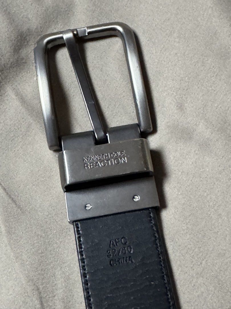 Kenneth Cole Reaction Leather Belt Size 32/80 (Category: Belts) located in Manila. Submitted by seangoart (Listing ID 1465587720, Image 3). Description: - Brand: Kenneth Cole Reaction - Color: Classic black - Material: Genuine leather - Size: 32/80 - Buckle: Brushed silver with engraved logo and convenient swivel mechanism - Origin: Made in China - Style: Versatile standard pin buckle design, ideal for both smart-casual and formal outfits.