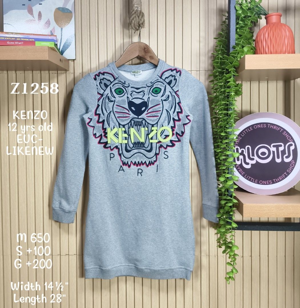 Kenzo Kids (Category: Babies & Kids Fashion) located in Quezon City. Submitted by christinejoycheng1 (Listing ID 1465737855, Image 1). Description: - Brand: Kenzo Kids - Size: 12 Years - Design: Large embroidered tiger face - Details: Ribbed crew neck, cuffs, and hem, long sleeves - Measurements: Width 14.5 inches, Length 28 inches - Condition: Excellent, care tag attached inside.