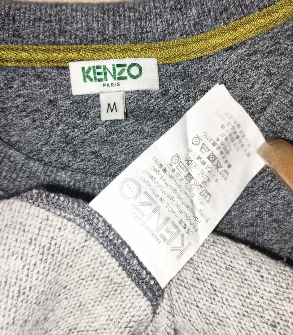 Kenzo Paris Eye Sweatshirt Grey Medium (Category: Coats, Jackets and Outerwear) located in Quezon City. Submitted by christinejoycheng1 (Listing ID 1465739024, Image 2). Description: - Brand: Kenzo - Design: Iconic embroidered eye with yellow and black details - Color: Grey - Size: M (Width: 19", Length: 25") - Features: Ribbed cuffs and hem.