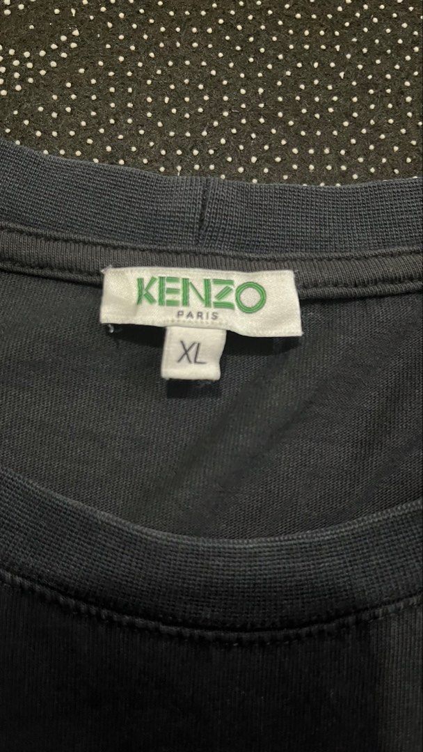 Kenzo T-shirt Paris (Category: Tshirts & Polo Shirts ) located in Porac. Submitted by macky.ron (Listing ID 1465752550, Image 3). Description: Length:26 Width: 20.5 Condition: Good Color rate: 8.5/10 Issue (s): hair lines Complete Tags.