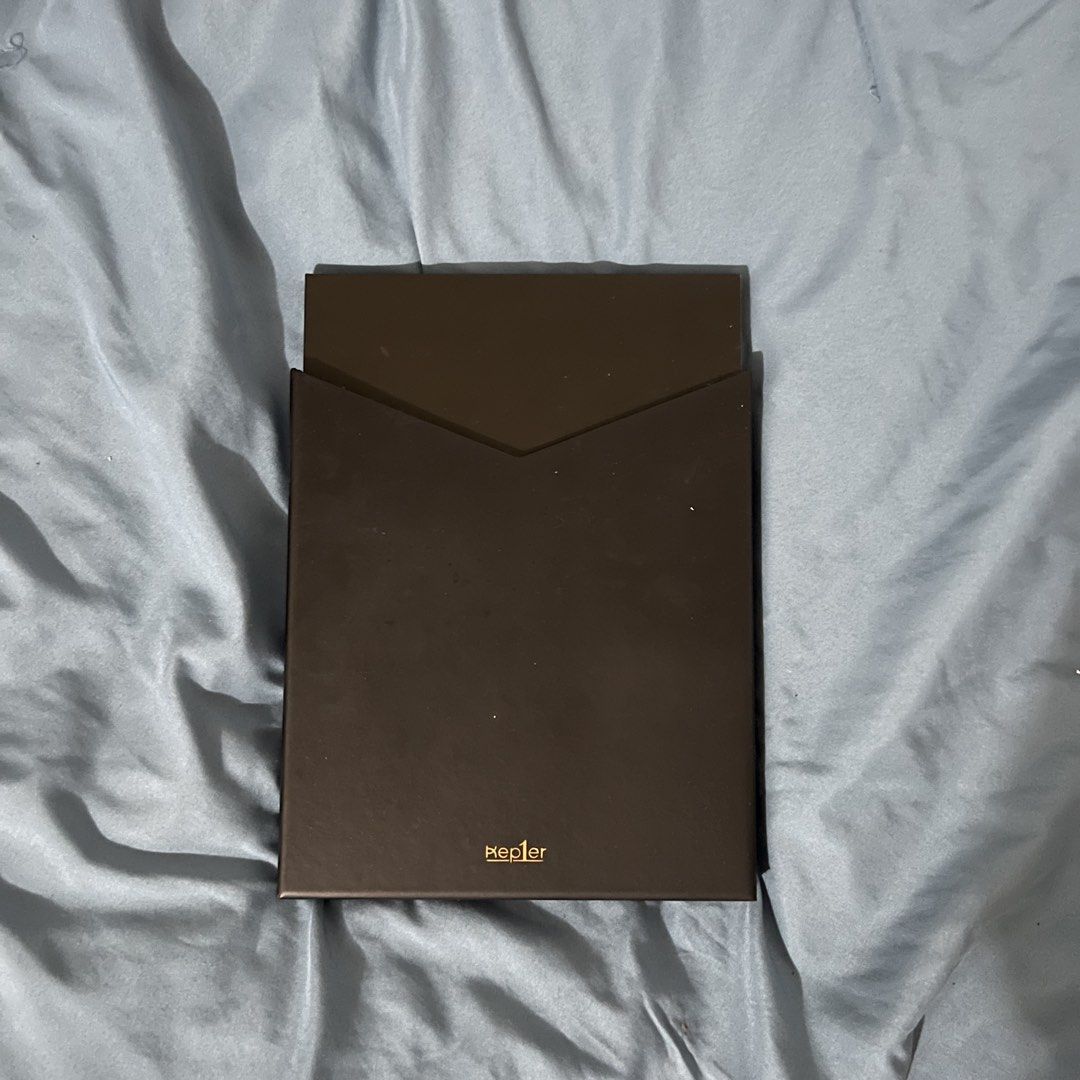 Kep1er First Impact Album (Category: CDs & DVDs) located in Naga. Submitted by drowinchai (Listing ID 1465686192, Image 2). Description: - Album: Kep1er First Impact Debut Album - Design: Elegant black and gold packaging - Inclusions: Outer sleeve, photobook, CD, and sticker sheet - Condition: Carefully stored and well-maintained - Shipping fee shouldered by buyer - MOP: Gcash/Bank Transfer.