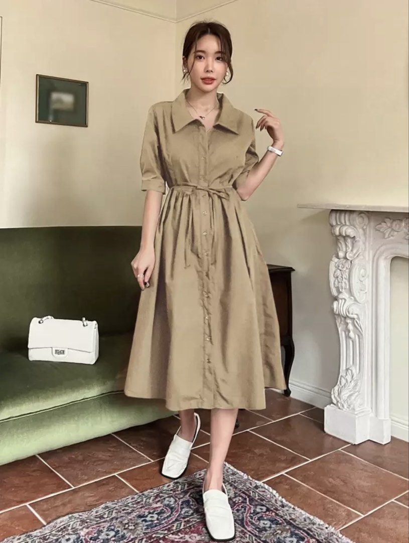 Khaki midi shirt dress with button front (Category: Dresses) located in Mandaue City. Submitted by klosetfindscebu (Listing ID 1465660737, Image 2). Description: - Color: Khaki / Neutral tone - Style: Midi dress with pointed collar and short sleeves - Details: Full button-down front with gathered waist - Length: Mid-calf - Condition: Clean and ready to wear - Styling tip: Pairs easily with white loafers or flats.