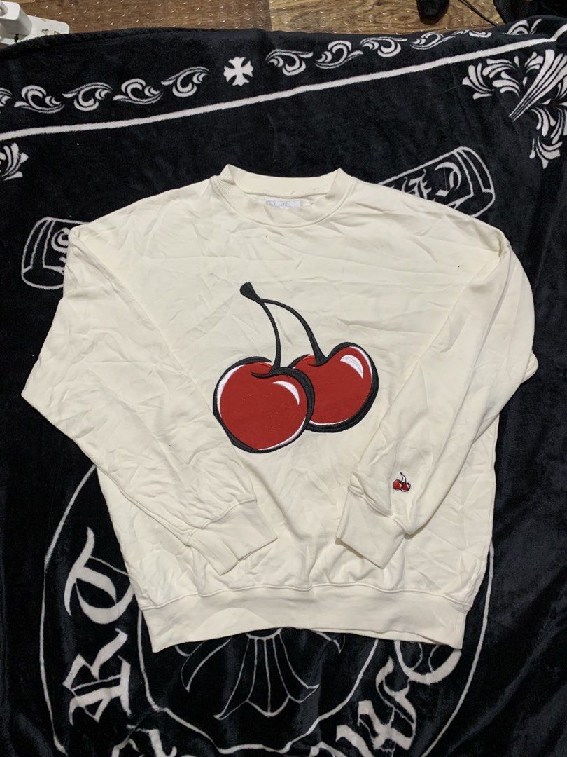 Kirsh Cherry Sweatshirt Off-White Size 1 (Category: Longsleeves) located in Iloilo. Submitted by johnpullan30303 (Listing ID 1465710134, Image 2). Description: - Brand: Kirsh - Color: Off-white - Size: 1 - Design: Large embroidered cherry on chest, small cherry logo on left sleeve cuff - Material: Thick cotton fleece, warm and comfortable - Details: Ribbed collar, cuffs, and hem - Condition: Great everyday streetwear piece.