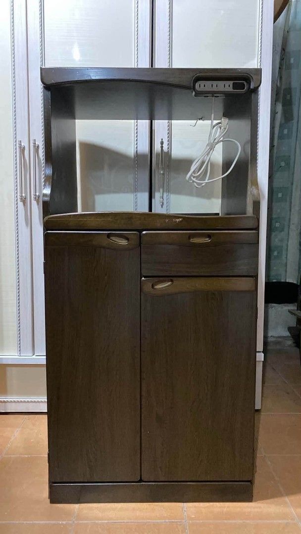 Kitchen Side Cabinet Oven Rack Coffee Nook (Category: Shelves, Cabinets & Racks) located in Quezon City. Submitted by dannikkishoppe2 (Listing ID 1465686415, Image 2). Description: Kitchen Side Cabinet Oven Rack Coffee Nook ‼️₱6000‼️ L23.5 W18 H48 inches Pullout tray: L20.5 W15.5 H13.5 inches *with 20kg rice dispenser *with small pantry and pullout tray *removable shelves *with built-in outlet for microwave, rice cooker, or other appliances Pleas