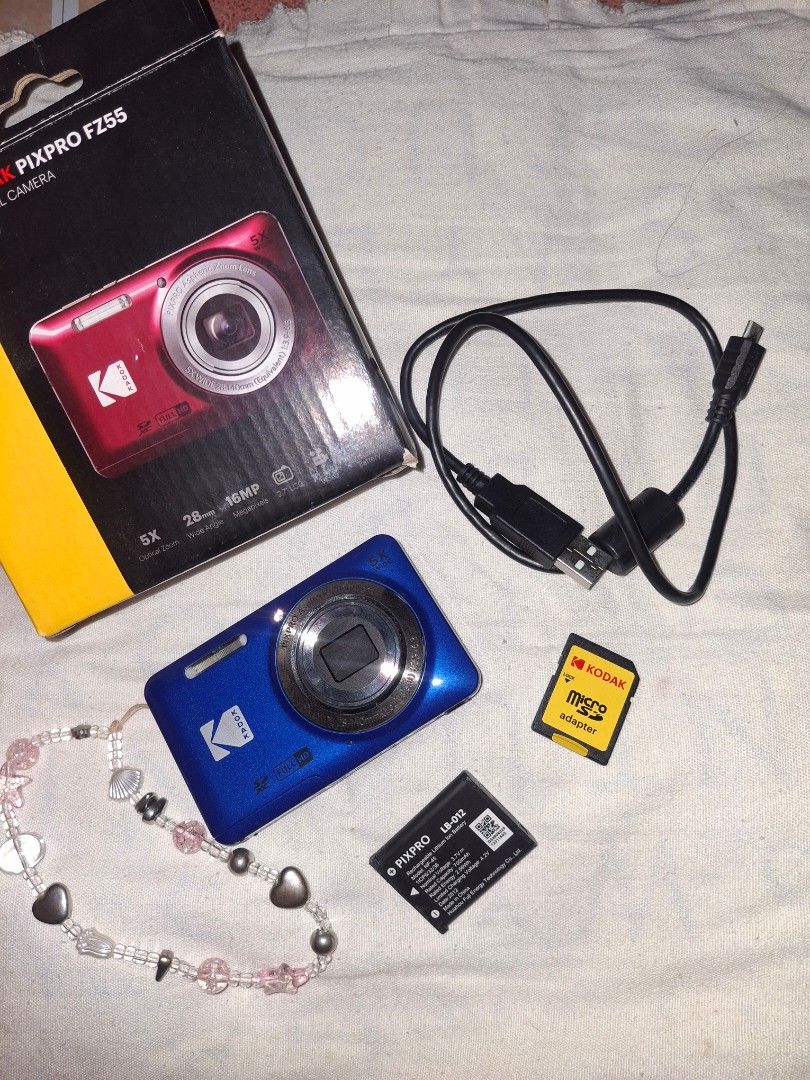 Kodak Pixpro FZ55 Blue Digital Camera (Category: Cameras) located in Muntinlupa City. Submitted by alhenabrailley (Listing ID 1465601802, Image 1). Description: (negotiable!!!) - Color: Blue - Specs: 16 Megapixels, 5x Optical Zoom - Condition: Tested, fully working, screen and buttons in great shape - Inclusions: Original box, USB charging cable, rechargeable battery, micro SD card adapter (OG KODAK).