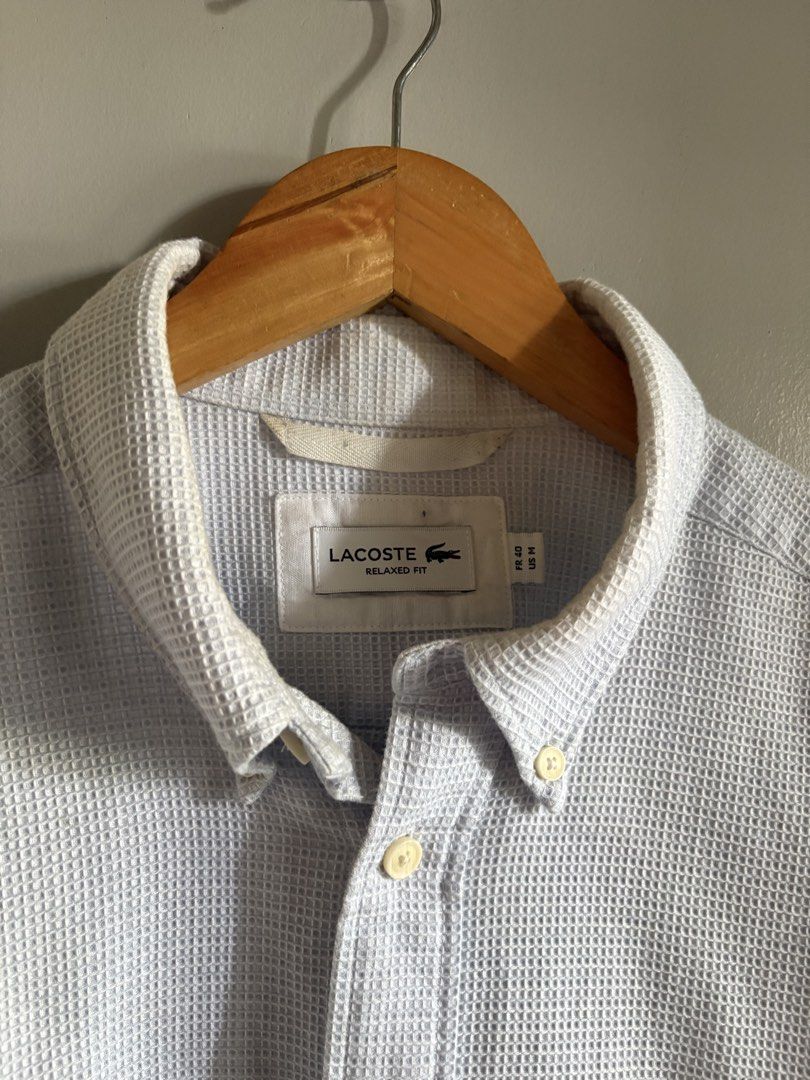 Lacoste light blue textured button-down polo (Category: Formal Shirts) located in General Santos City (Dadiangas). Submitted by a.rt.eyes (Listing ID 1465656570, Image 3). Description: For Sale! Lacoste light blue textured button-down polo Size on tag 40 (medium) Actual dimension width 23 length 27 Excellent condition Color rate 9/10 Need wash only Authentic Location general santos city .