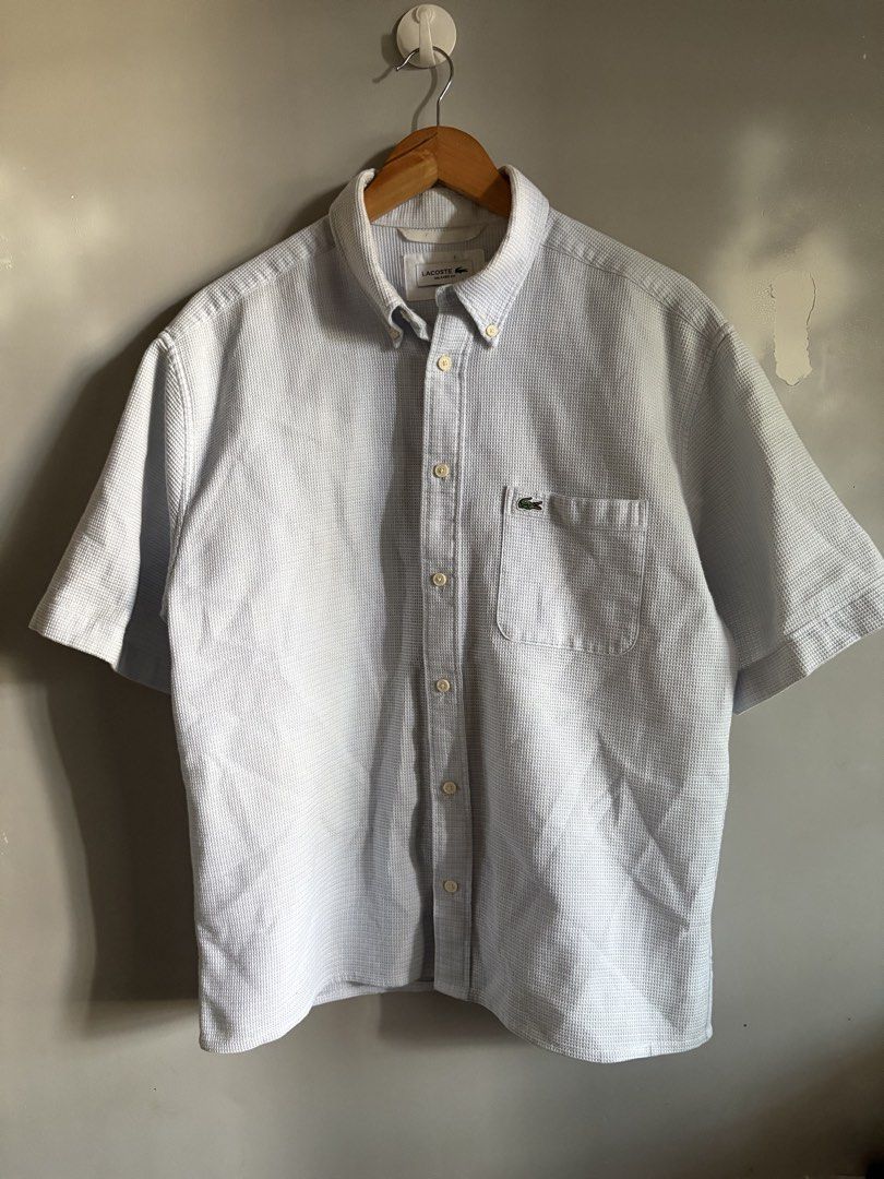 Lacoste light blue textured button-down polo (Category: Formal Shirts) located in General Santos City (Dadiangas). Submitted by a.rt.eyes (Listing ID 1465656570, Image 1). Description: For Sale! Lacoste light blue textured button-down polo Size on tag 40 (medium) Actual dimension width 23 length 27 Excellent condition Color rate 9/10 Need wash only Authentic Location general santos city .