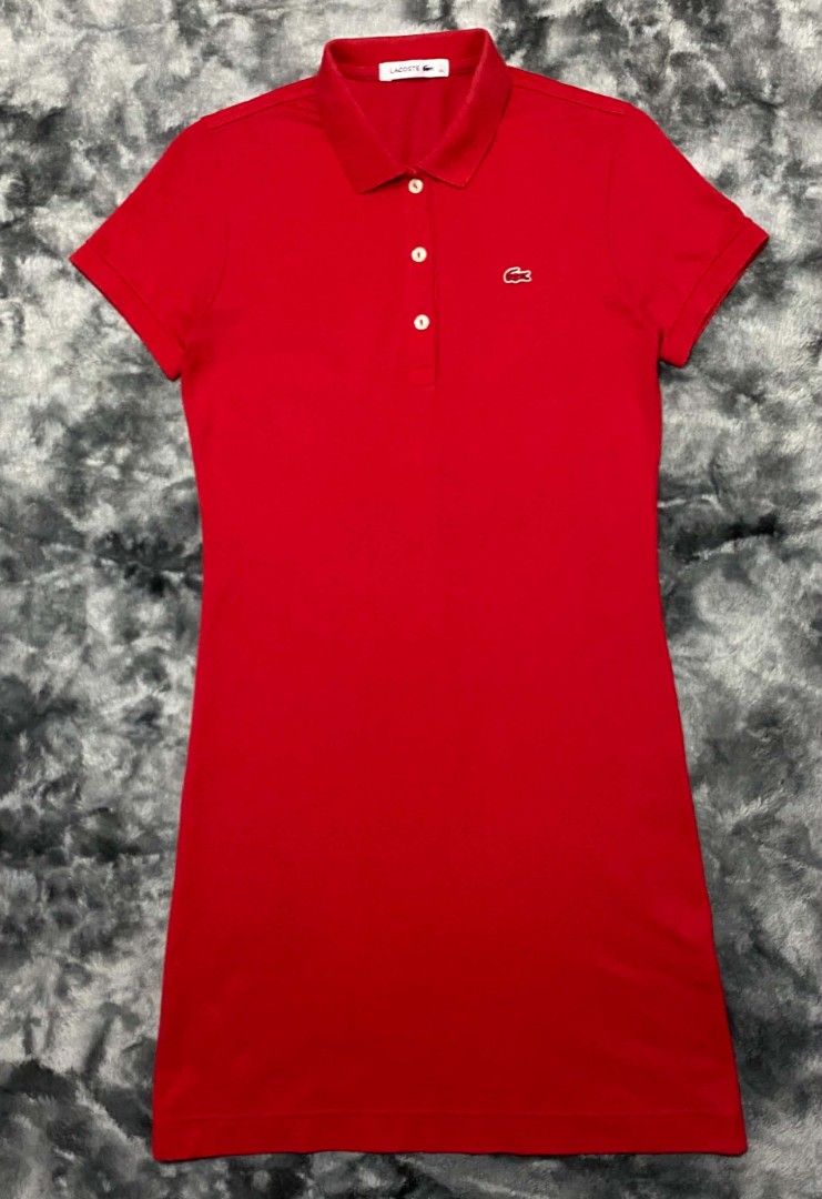 Lacoste Red Polo Dress Size 36 (Category: Dresses) located in Sorsogon. Submitted by johnmichae69459 (Listing ID 1465699583, Image 1). Description: - Brand: Lacoste - Item: Polo Dress - Color: Bright Red - Size: 36 (Made in Korea) - 17 width - 35 lenght - Features: Short sleeves, classic collar with 3-button placket, ribbed collar and cuffs, signature embroidered crocodile logo.