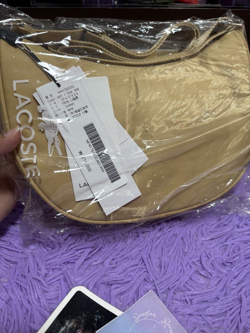 Lacoste saddle bag beige (Category: Cross-body Bags) located in Pasig City. Submitted by queenv18 (Listing ID 1465598274, Image 1). Description: Onhand items in PH ready to ship merch are directly shipped from korea / taiwan / japan / us 101% legit Brandnew Plus sf .