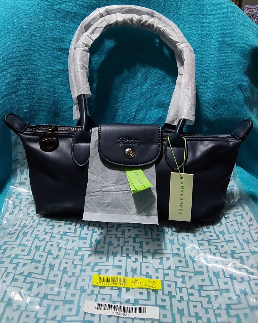 LC Soft Cowhide Navy Tote (Category: Shoulder Bags) located in Las Pinas. Submitted by jpmshoppe (Listing ID 1465673228, Image 1). Description: Navy Blue baguette-style East-West silhouette Cowhide leather body Long handle shoulder carry Zip closure with snap-button flap One flat interior pocket Fits phone, wallet, keys, daily essentials, etc Approx. size: 26 × 11 × 8.5 cm .
