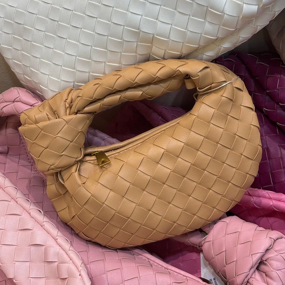 Leather Woven Mini Handbag (Category: Purses & Pouches) located in Marikina City. Submitted by preloved_n_reloved (Listing ID 1465665407, Image 2). Description: - Color: Khaki - Hardware: Gold-tone - Features: Top handle with knotted accent, secure zip closure, soft slouchy hobo shape - Condition: Unused with tag attached, clean interior.