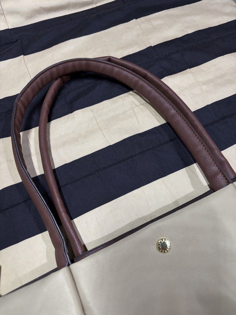 Legato Largo (Category: Tote Bags) located in Pasay City. Submitted by marliencalimag (Listing ID 1465583057, Image 2). Description: Elegant cream/taupe color • Spacious and perfect for everyday use • Stylish & easy to pair with different outfits • Good condition & well-maintained • Perfect for school, work, or casual days 👜 🏷️ Selling price: ₱2,300 📌 RFS: Decluttering 📦 Shipping available 💬 PM if interested!.