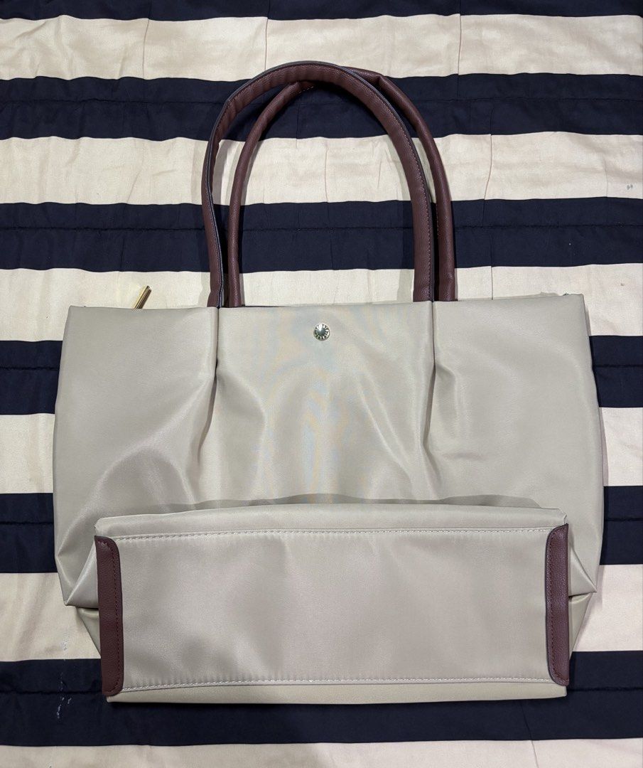 Legato Largo (Category: Tote Bags) located in Pasay City. Submitted by marliencalimag (Listing ID 1465583057, Image 1). Description: Elegant cream/taupe color • Spacious and perfect for everyday use • Stylish & easy to pair with different outfits • Good condition & well-maintained • Perfect for school, work, or casual days 👜 🏷️ Selling price: ₱2,300 📌 RFS: Decluttering 📦 Shipping available 💬 PM if interested!.