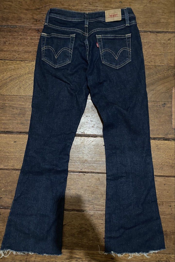 Levi's 518 Super Low Boot Cut Jeans Dark Wash (Category: Jeans) located in Caloocan City. Submitted by cleverwater.ba6482 (Listing ID 1465713521, Image 2). Description: Authentic Levi's 518 Super Low Boot Cut jeans in a versatile dark wash denim. Features a stretchy cotton blend (98% cotton, 2% lycra spandex), a button fly, and trendy raw frayed hems. Made in Turkmenistan. Size details available upon request—grab these classic Y2K staples today!.