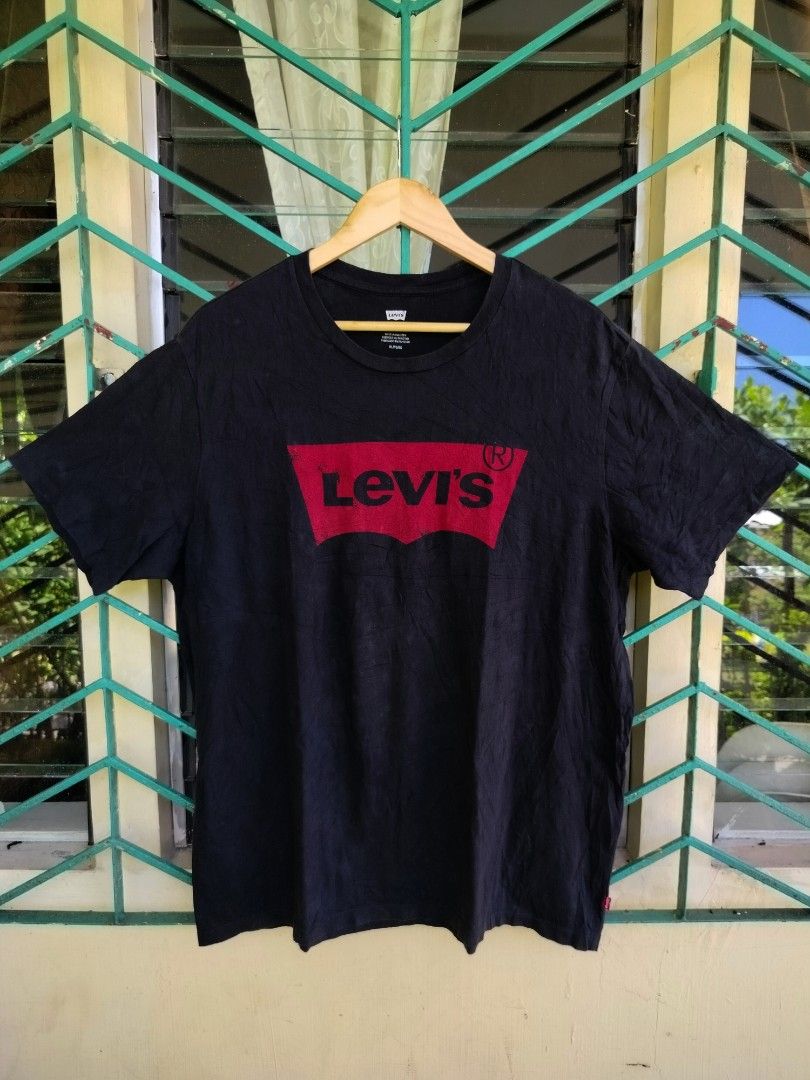 Levi's Black Graphic Tee Size XL (Category: Tshirts & Polo Shirts ) located in Manila. Submitted by gerald_quinto (Listing ID 1465709756, Image 1). Description: - Brand: Levi's - Style: Crew neck, short sleeve tee - Color: Black with red & black batwing logo - Size: XL -Dimes 30×24 - Material: 100% Cotton - Condition: Brand new with tags intact - Origin: Made in Pakistan.