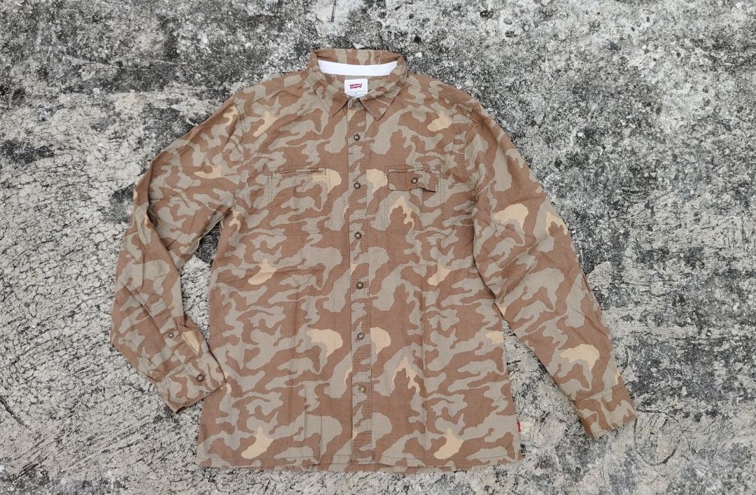 Levis Camouflage Long Sleeve (Category: Formal Shirts) located in Mati. Submitted by gsthrift (Listing ID 1465671129, Image 1). Description: size Medium on tag Length 28.5 Width 22 Sleeve 30.5 issue: dalawang small pin holes sa dulo ng sleeve.