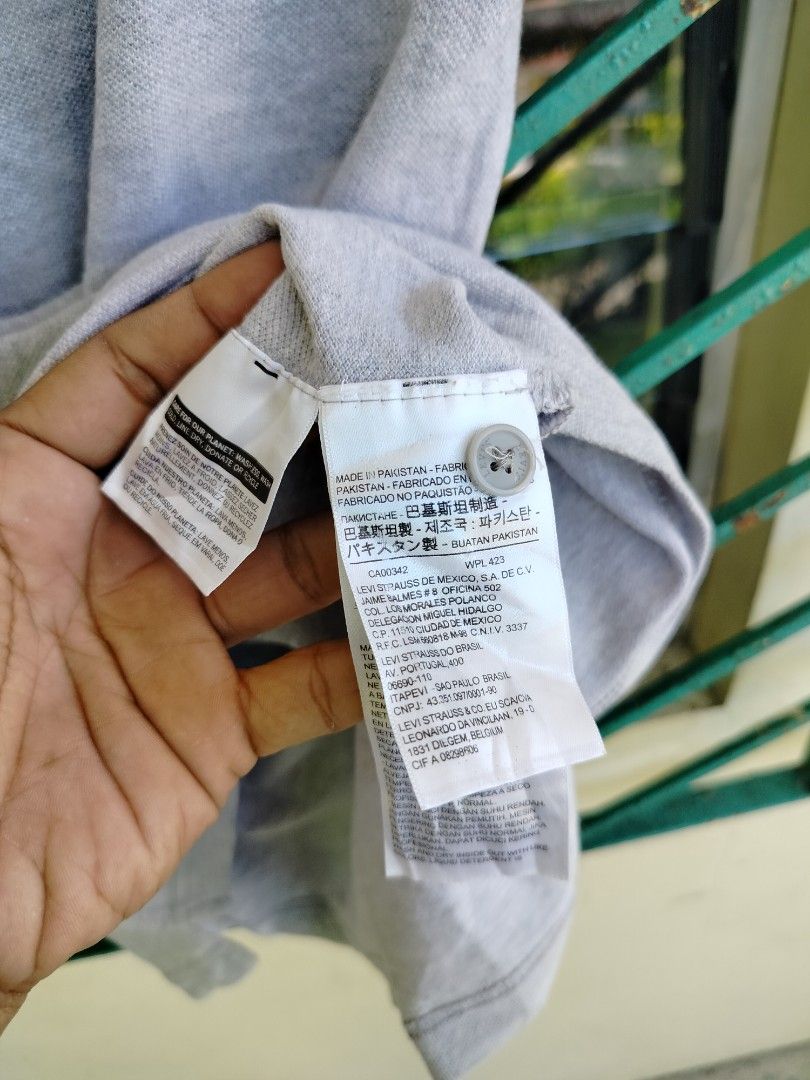Levi's Grey Polo Shirt Size M (Category: Tshirts & Polo Shirts ) located in Manila. Submitted by virgiliosa38485 (Listing ID 1465705850, Image 3). Description: - Brand: Levi's - Color: Grey - Size: M (Standard fit) -Dimes 27×20 - Style: Short sleeve polo with button placket - Details: Iconic red Levi's logo tab on the chest - Condition: Clean, with original fabric and care labels intact - Perfect versatile basic for casual daily wear.