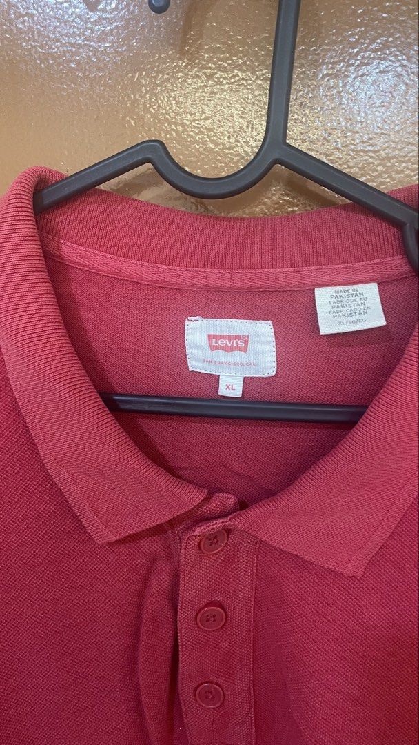Levi's Red Polo Shirt XL (Category: Tshirts & Polo Shirts ) located in Manila. Submitted by astrida21 (Listing ID 1465674428, Image 3). Description: - Brand: Levi's - Color: Red - Size: XL - Fit: Regular fit for everyday comfort - Details: Classic three-button placket with a subtle chest logo tag - Origin: Made in Pakistan - Condition: Great everyday wear piece, grab it before it's gone!.