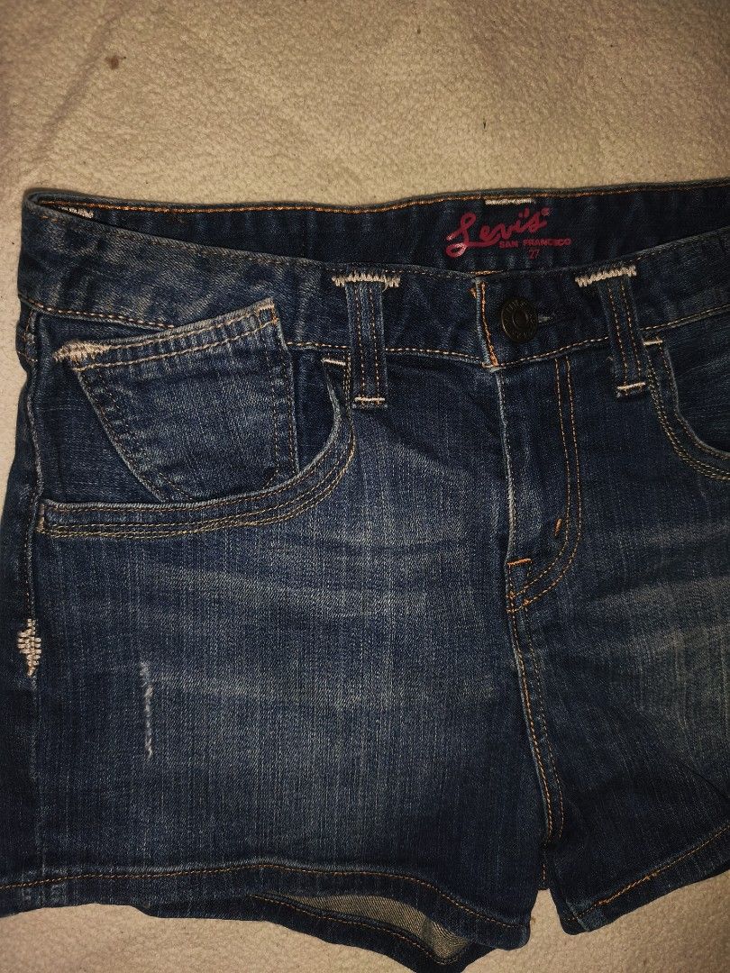 Levi's San Francisco Denim Shorts (Category: Shorts) located in Cagayan de Oro. Submitted by elijah350below (Listing ID 1465682242, Image 2). Description: - Brand: Levi's - Style: Denim shorts with distressed accents - Wash: Dark blue - Waist Size: 27 - Fit: Mid-rise with classic 5-pocket styling - Details: Leather back patch and pink Levi's San Francisco inner waistband print - Origin: Made in Indonesia - Condition: Excellent/Ready to wear excel