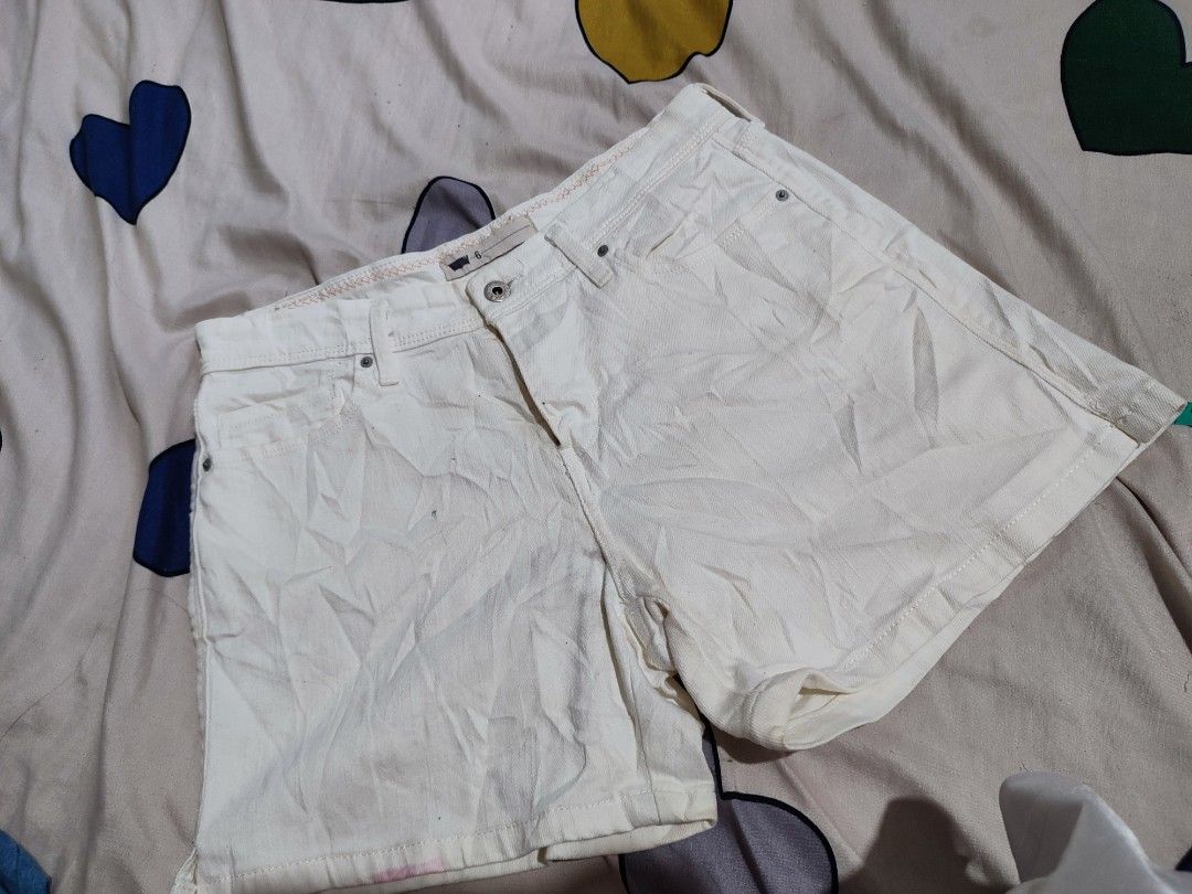 Levi's White Denim Shorts W28 (Category: Shorts) located in Manila. Submitted by mommyregsthriftclothes (Listing ID 1465633929, Image 2). Description: - Brand: Levi's - Color: Solid off-white - Size: W30 - Fit: Straight fit through the thigh - Closure: Button fly - Details: Classic back pockets with signature leather patch - Condition: Great versatile piece for warm weather.